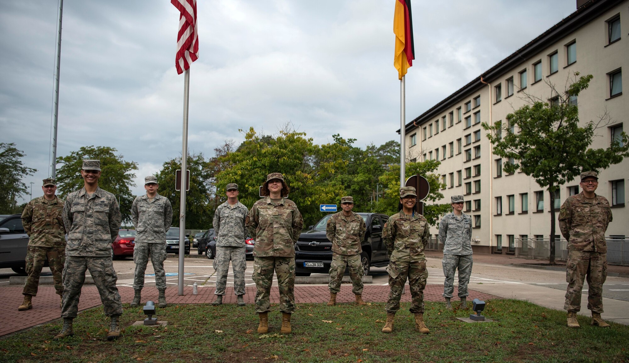 U.S. Air Force Airmen pose for a photo before a U.S. Space Force transfer ceremony.