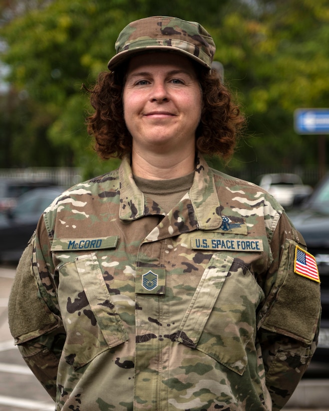 U.S. Space Force Master Sgt. Jennifer McCord, U.S. Air Forces in Europe plans and requirements space functional area manager, poses for a photo after a USSF transfer ceremony.