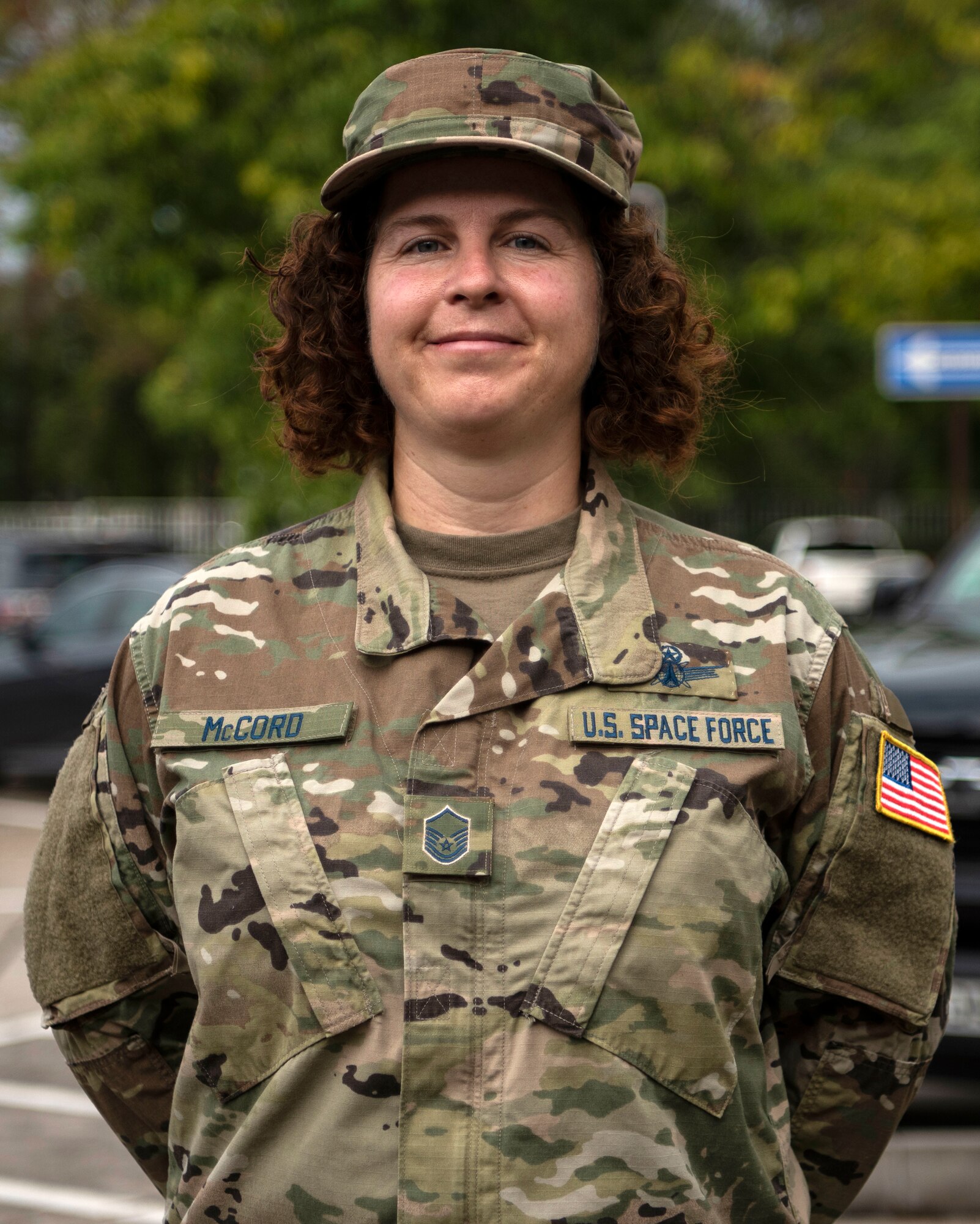 U.S. Space Force Master Sgt. Jennifer McCord, U.S. Air Forces in Europe plans and requirements space functional area manager, poses for a photo after a USSF transfer ceremony.