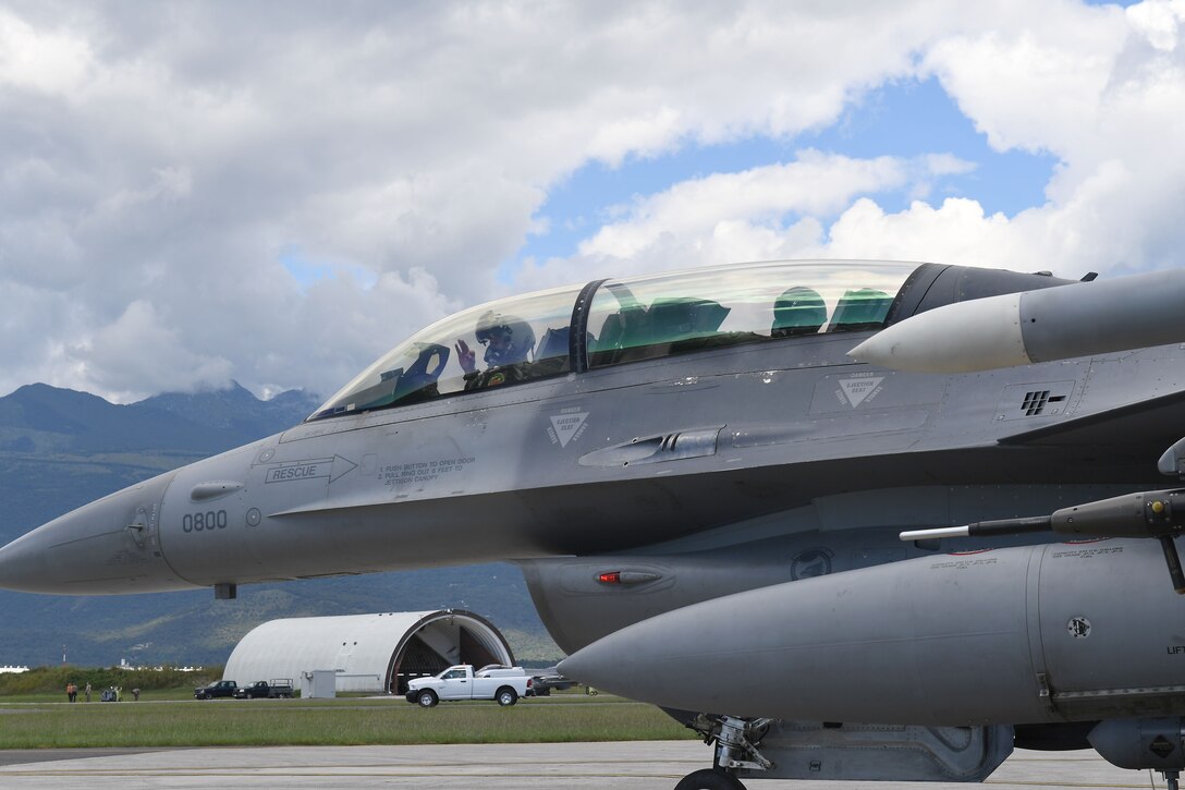 U.S. Air Force Staff Sgt. Devon Kercher, 31st Operations Support Squadron Radar Approach Control senior watch supervisor, and a U.S. Air Force F-16 Fighting Falcon pilot prepare for takeoff at Aviano Air Base, Italy, Sept. 3, 2020.  Kercher took part in a familiarization flight on the F-16. (U.S. Air Force photo by Staff Sgt. Valerie Halbert)