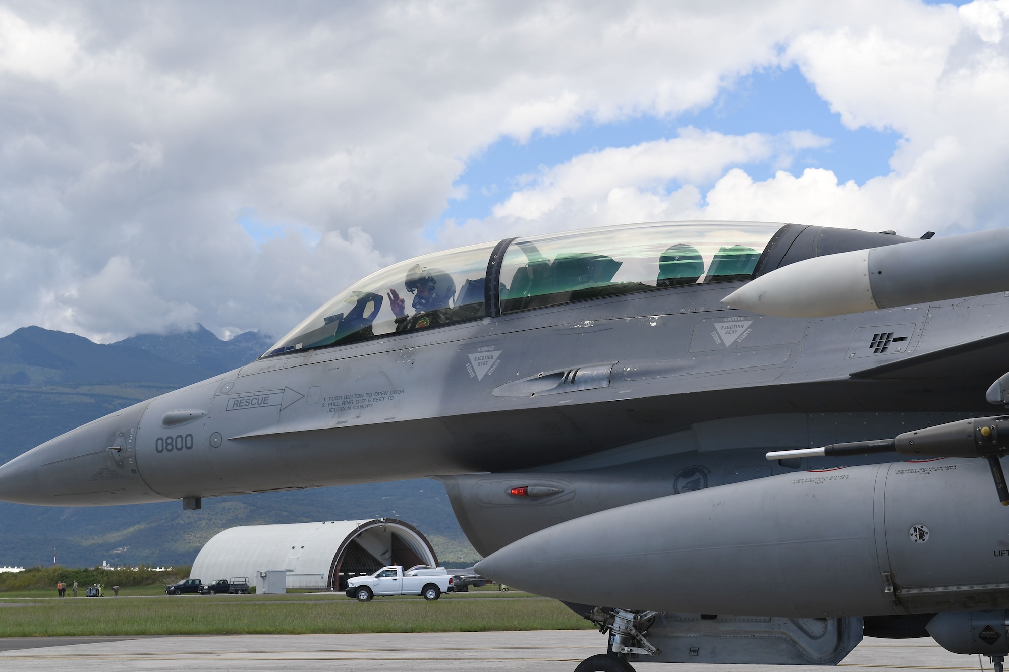 U.S. Air Force Staff Sgt. Devon Kercher, 31st Operations Support Squadron Radar Approach Control senior watch supervisor, and a U.S. Air Force F-16 Fighting Falcon pilot prepare for takeoff at Aviano Air Base, Italy, Sept. 3, 2020.  Kercher took part in a familiarization flight on the F-16. (U.S. Air Force photo by Staff Sgt. Valerie Halbert)