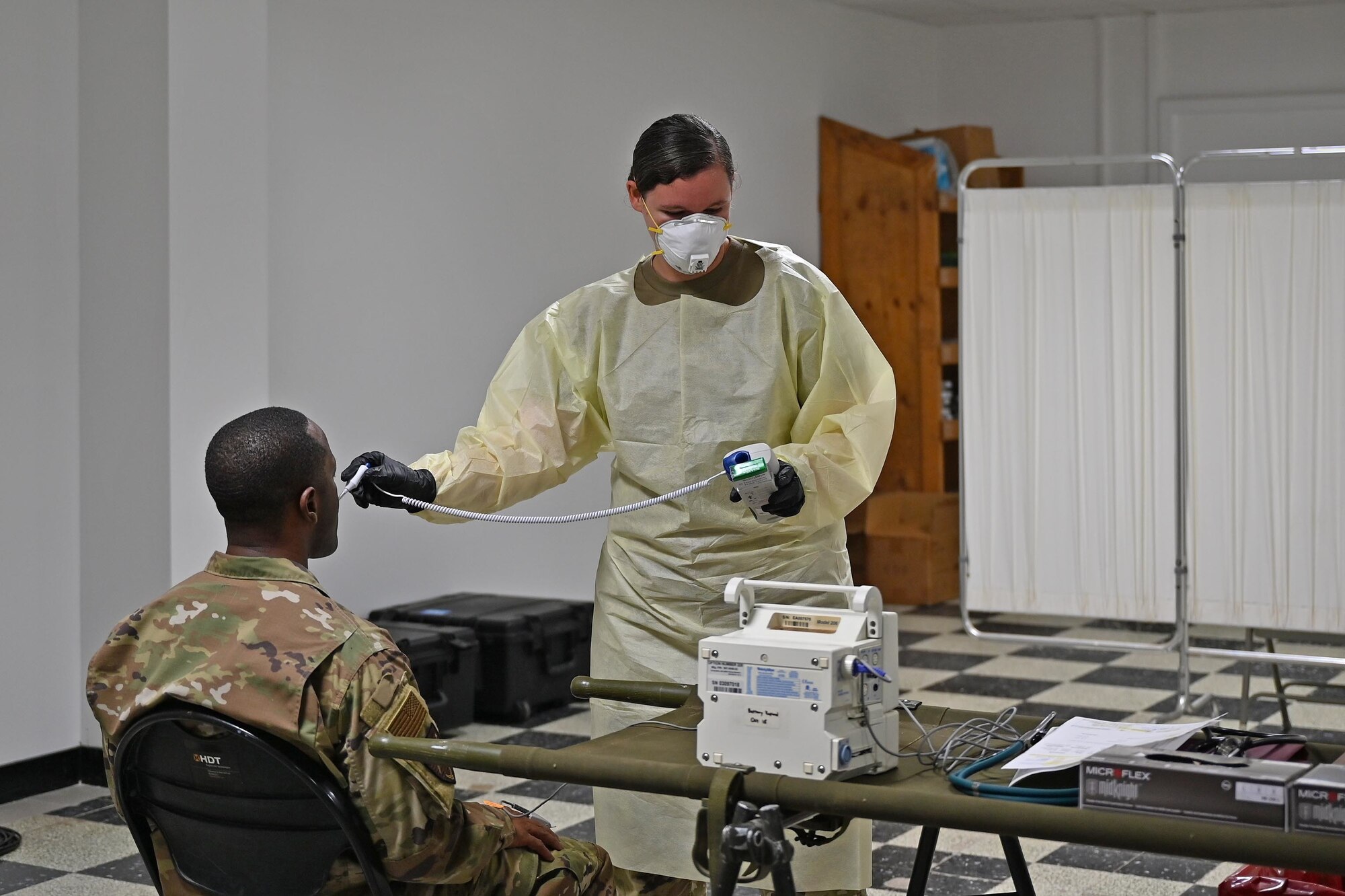 U.S. Air Force Brig. Gen. Ronald E. Jolly, Headquarters U.S. Air Forces in Europe – Air Forces Africa engineering and force protection director of logistics, has his temperature taken during an expeditionary medical screening after arriving at Camp Lemonnier, Djibouti, September 1, 2020. USAFE-AFAFRICA leadership visited Airmen from around the 449th Air Expeditionary Group deployed throughout Africa to see the mission first hand and show appreciation for the Airmen stationed down range. (U.S. Air Force photo by Staff Sgt. Dana J. Cable)