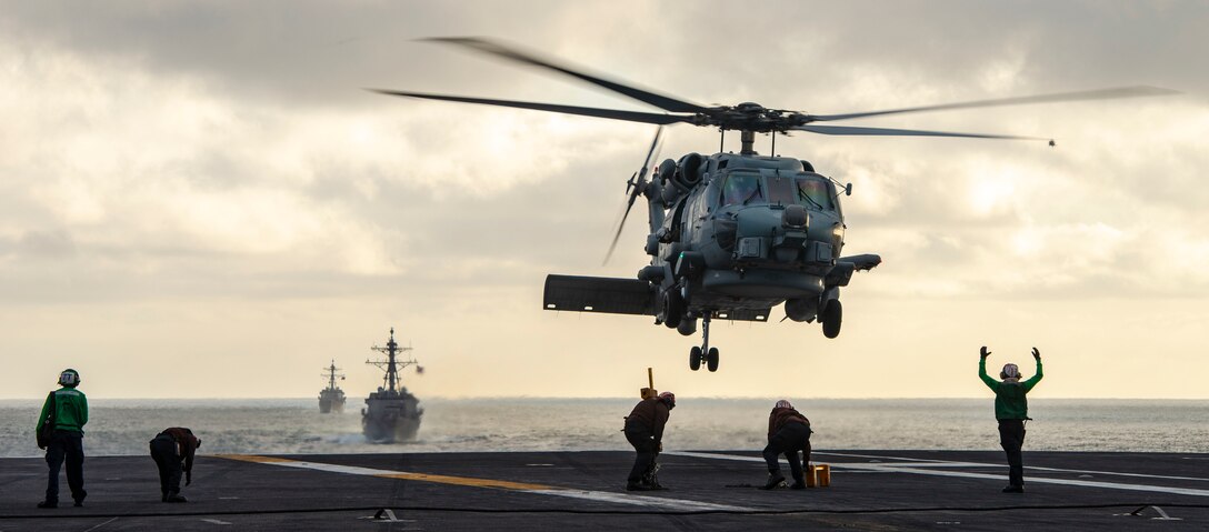 MH-60R Sea Hawk Helicopter from “Battlecats” of Helicopter Maritime Strike Squadron (HSM) 73 takes off from flight deck of USS Nimitz (CVN 68) during simulated Strait Transit as part of composite training unit exercise, Pacific Ocean, May 14, 2020 (U.S. Navy/Sarah Christoph)