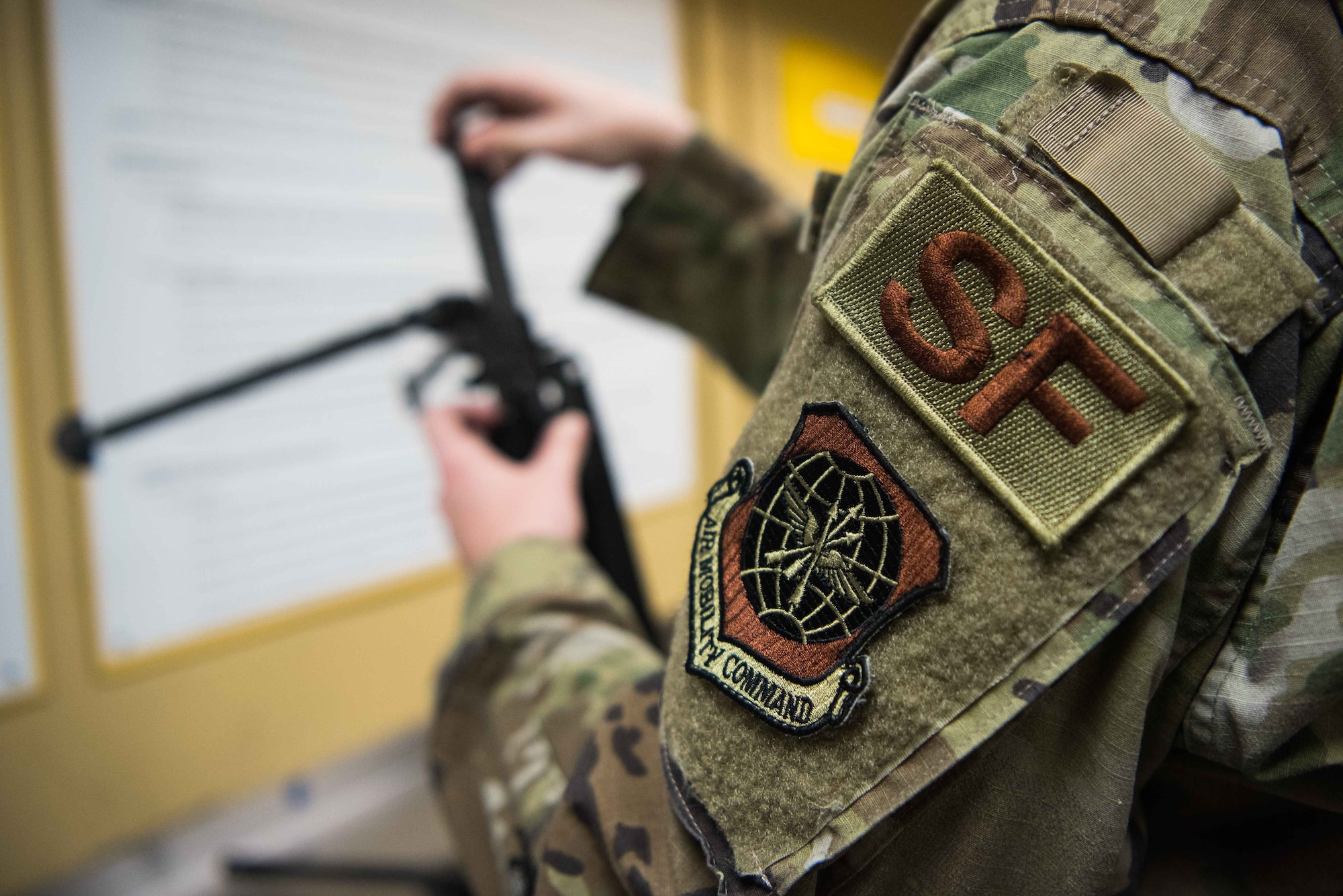 Airman 1st Class Brandon Holland, 22nd Security Forces Squadron armorer, reassembles an M249 light machine gun back together after performing a functionality check Sept. 8, 2020, at McConnell Air Force Base, Kansas. Each SFS member turns in an Air Force Form 629 small arms hands receipt that states their eligibility and qualifications to handle any weapon the armory issues. (U.S. Air Force photo by Senior Airman Alexi Bosarge)