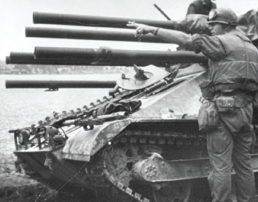 A man directs tank fire.