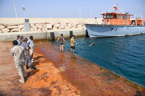 U.S. Navy explosive ordnance disposal technicians, assigned to Commander, Task Force 56, conduct a anti-terrorism force protection (ATFP) dive training with the Royal Jordanian Navy during Exercise Infinite Defender 2020 (ID 20) at the Royal Jordanian Naval Base in Aqaba, Jordan.