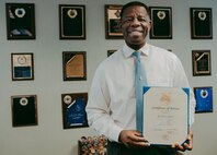 Alvin Green, director of cyberspace plans and resources for the 628th Communications
Squadron, holds his Certificate of Service at Joint Base Charleston, S.C., Sept. 9, 2020. Green
recently celebrated 40 years of military and civilian service;tires on December 31, 2020 after 40
years of civil and military service. Green retires on December 31, 2020 after 40 years of civil
and military service.(