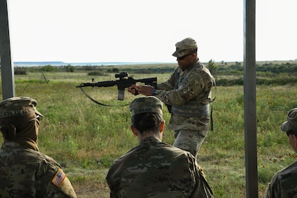 Soldiers from the Alaska Army National Guard receive a primary marksmanship instruction from a member of the 120th Infantry Brigade, class upon arriving at the range on Fort Hood, Texas, May 27, 2020. This detailed instruction helped all of the Soldiers from Alaska qualify in preparation for their mobilization to Poland. (U.S. Army National Guard Photo by SGT Heidi Kroll)