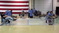 Alaska Department of Military and Veterans Affairs personnel, including National Guardsmen, members of the State Defense Force, and state employees, donate blood to the Blood Bank of Alaska at a mobile center set up in the Guard armory on Joint Base Elmendorf-Richardson, May 26, 2020. Blood donation centers have been impacted by a lack of donors during the COVID-19 pandemic, while the need for blood, plasma and platelets continue to be critically needed for many medical services. (U.S. Army National Guard photo by Sgt. Seth LaCount/Released)