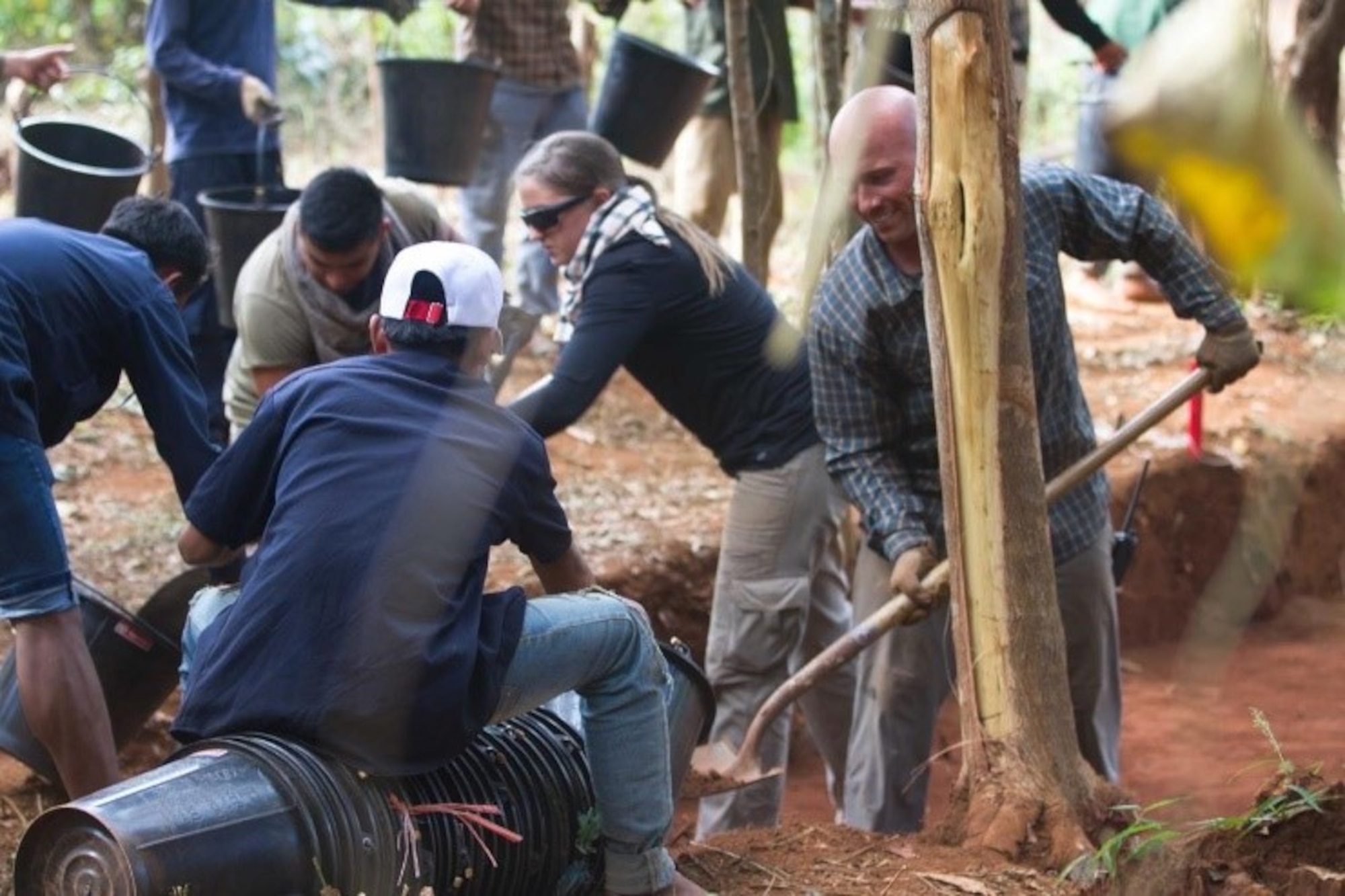 Americans and Lao workers dig at Vietnam War Era F-4 crash in search of two missing in action pilots, Savannakhét Province, Laos, July 15 2019.