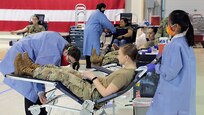 Alaska Department of Military and Veterans Affairs personnel, including National Guardsmen, members of the State Defense Force, and state employees, donate blood to the Blood Bank of Alaska at a mobile center set up in the Guard armory on Joint Base Elmendorf-Richardson, May 26, 2020. Blood donation is essential for hospitals to be able to take care of those who need it. The demand for blood products (blood, platelets and plasma) is constant, even when the world isn’t in the midst of a global pandemic. (U.S. Army National Guard photo by Sgt. Seth LaCount/Released)