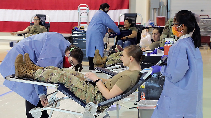 Alaska Department of Military and Veterans Affairs personnel, including National Guardsmen, members of the State Defense Force, and state employees, donate blood to the Blood Bank of Alaska at a mobile center set up in the Guard armory on Joint Base Elmendorf-Richardson, May 26, 2020. Blood donation is essential for hospitals to be able to take care of those who need it. The demand for blood products (blood, platelets and plasma) is constant, even when the world isn’t in the midst of a global pandemic. (U.S. Army National Guard photo by Sgt. Seth LaCount/Released)