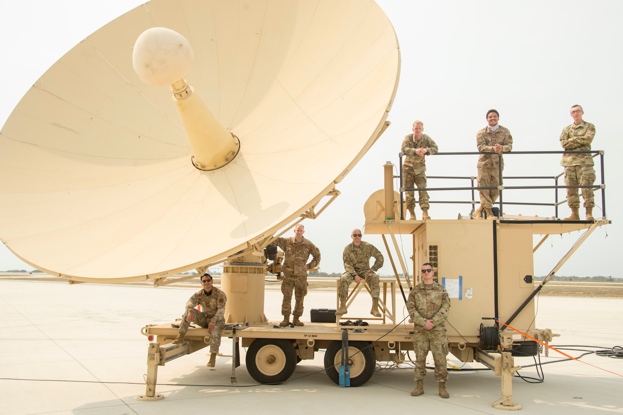 Members from Holloman Air Force Base pose with a satellite earth terminal subsystem during Agile Reaper on September 8, 2020, at Naval Air Station Point Mugu, California. Agile Reaper is a routine training exercise focused on the movements of MQ-9s Reaper overwater to improve upon the joint relationship and operational capabilities while displaying agile penetrating and persistent multi-role maritime combat capabilities. (U.S. Air Force photo by Senior Airman Collette Brooks)