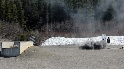 An Alaska Air National Guard pararescueman assigned to the 212th Rescue Squadron blows a paper silhouette off a steel target using an M67 fragmentation grenade at the Small Arms Complex on Joint Base Elmendorf-Richardson, Apr. 29, 2020. In cooperation with U.S. Army Alaska Soldiers, 14 pararescuemen used the grenade range to prepare for an upcoming deployment. (U.S. Army National Guard photo by Sgt. Seth LaCount/Released)