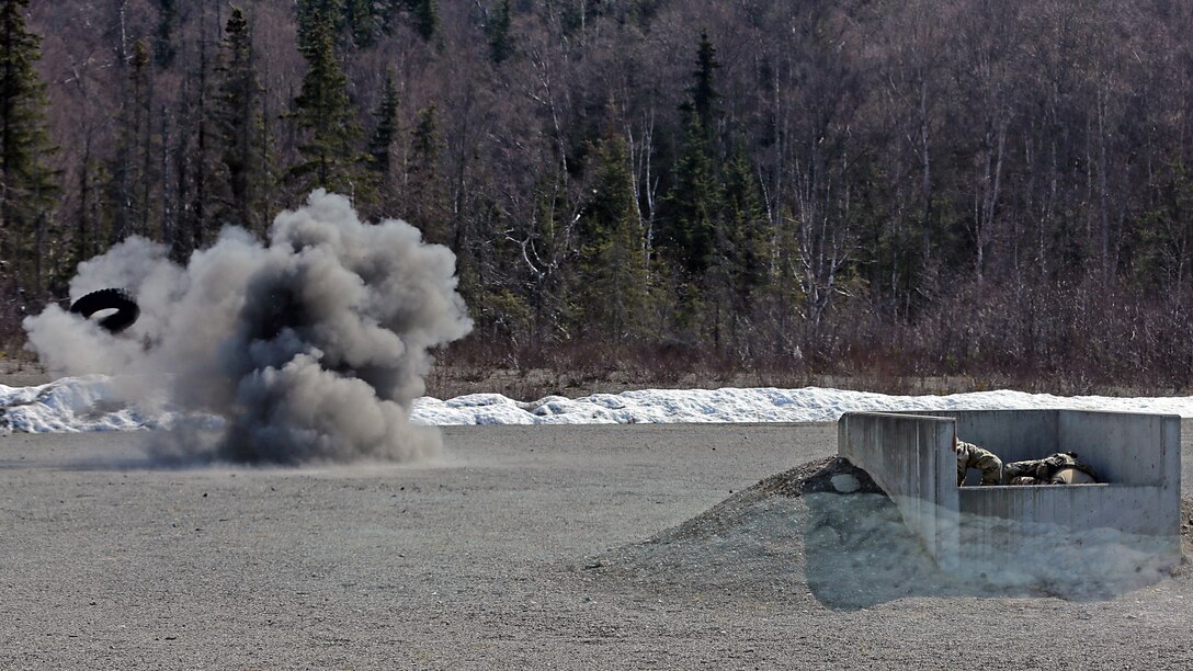 An Alaska Air National Guard pararescueman assigned to the 212th Rescue Squadron hits his mark using an M67 fragmentation grenade, sending a rubber tire flying through the air at the Small Arms Complex on Joint Base Elmendorf-Richardson, Apr. 29, 2020. 14 AKANG PJs used the grenade range run U.S. Army paratroopers (U.S. Army National Guard photo by Sgt. Seth LaCount/Released)