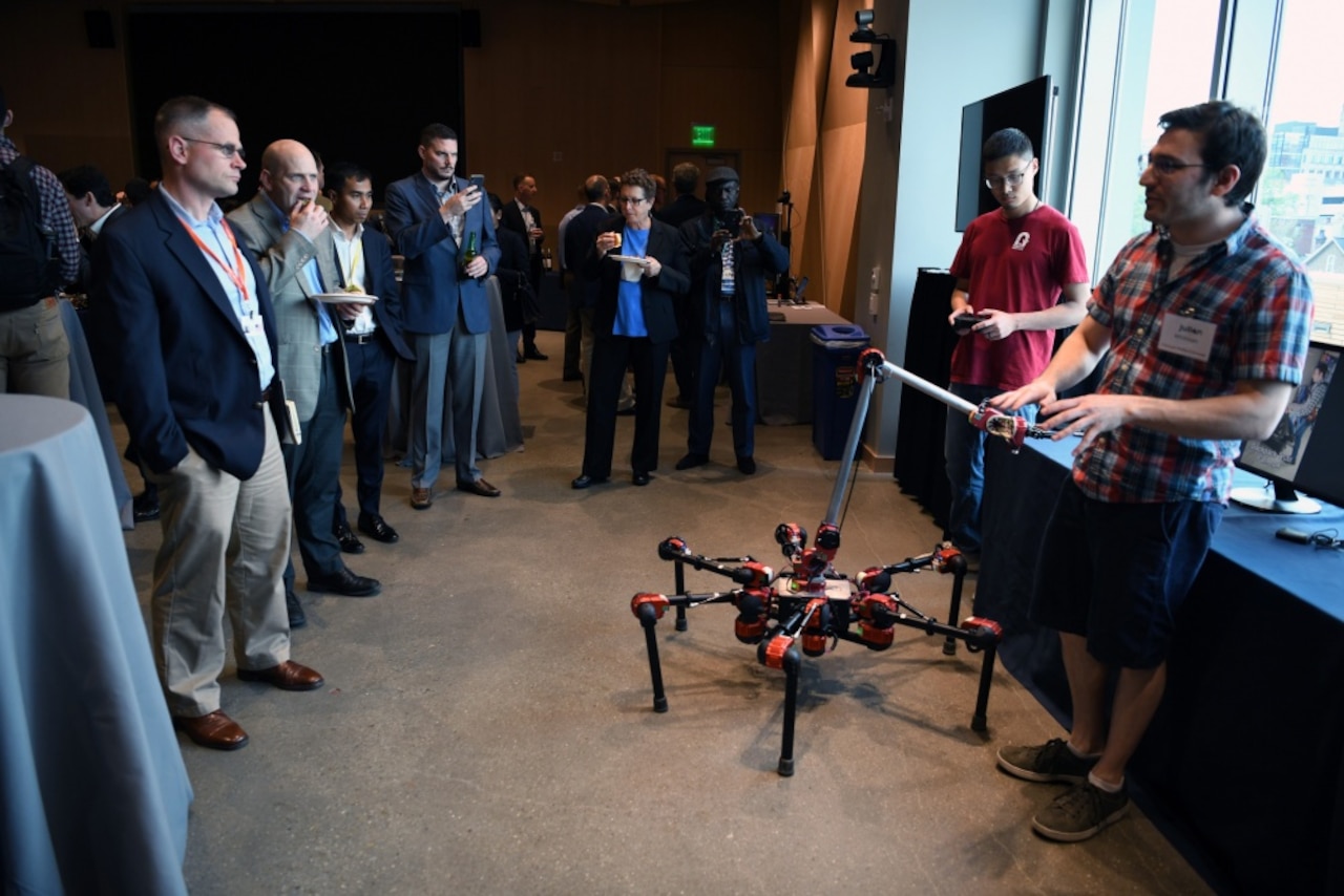 A student demonstrates robotic artificial intelligence.