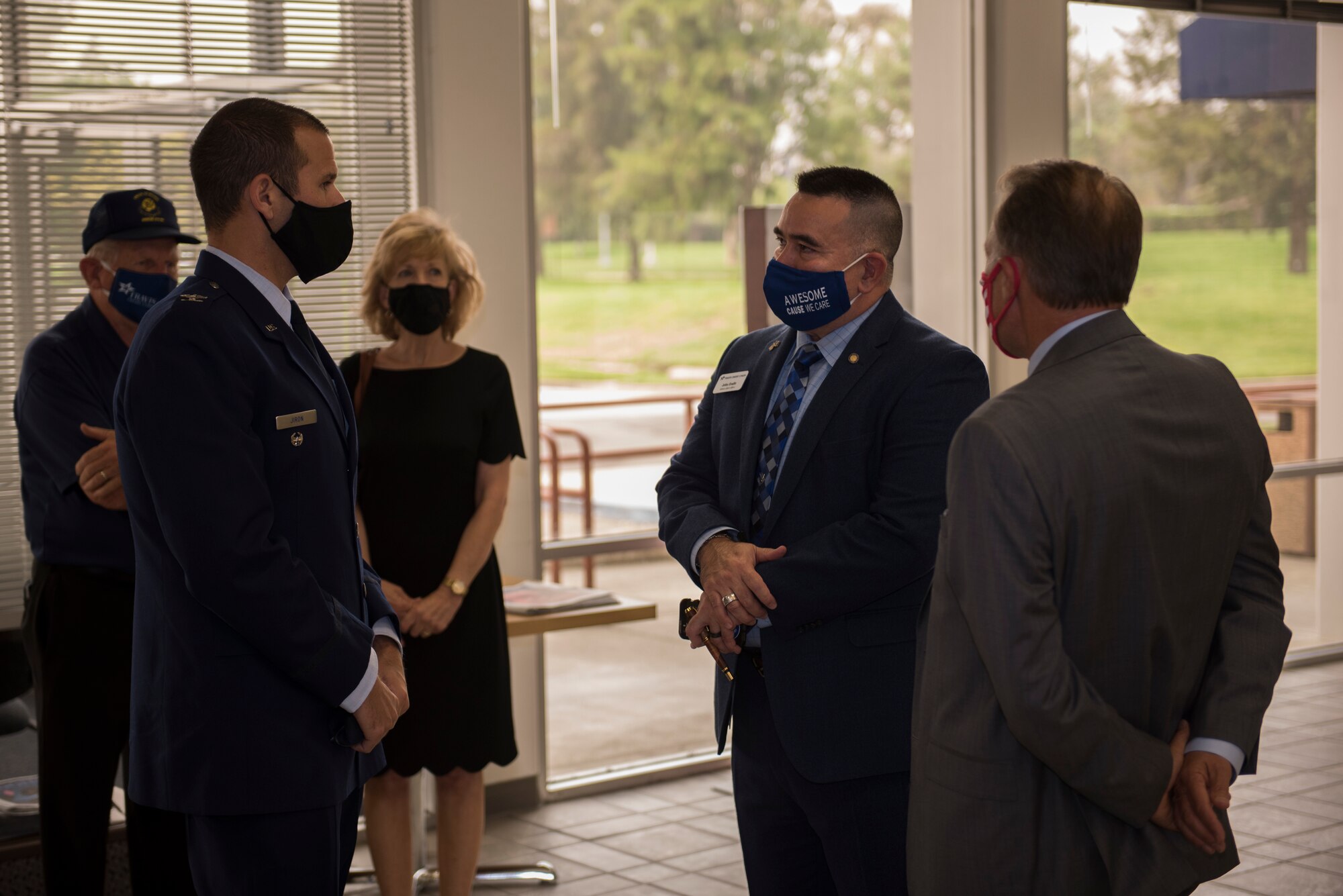 U.S. Air Force Col. Zachery Jiron, left, 60th Air Mobility Wing vice commander, speaks with Barry Nelson, far right, Travis Credit Union president and chief executive officer, and John Evalle, center, Travis Credit Union military affairs officer, during the 2019 Air Force Distinguished Credit Union Award presentation Sept. 9, 2020, at Travis Air Force Base, California. This marks the second year in a row that Travis Credit Union won this award. (U.S. Air Force photo by Senior Airman Cameron Otte)