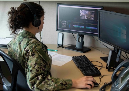 Mass Communication Specialist 3rd Class Victoria Granado, a member a the Alaska Naval Militia, edits video footage she took as public affairs coverage of COVID-19 response efforts from the Alaska National Guard, Alaska State Defense Force and the Alaska Naval Militia at Joint Base Elmendorf-Richardson, April 14, 2020. (U.S. Army National Guard photo by Spc. Grace Nechanicky/Released)