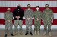Sailors on State Active Duty Orders for the Alaska Naval Militia pose for a group photo in the National Guard Armory at Joint Base Elmendorf-Richardson, April 14, 2020. (U.S. Navy photo by Mass Communication Specialist Victoria Granado/Released)