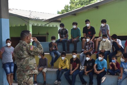 U.S. Army Capt. Joseph Sierra, Joint Task Force-Bravo Headquarters Support Company commander, speaks to a group of Honduran children at the Horizontes al Futuro Orphanage in Comayagua, Honduras, Sept. 5, 2020. Sierra led a team of volunteers to deliver $1000 in charitable donations to the local orphanage, while observing strict COVID-19 protocols to protect all members involved.