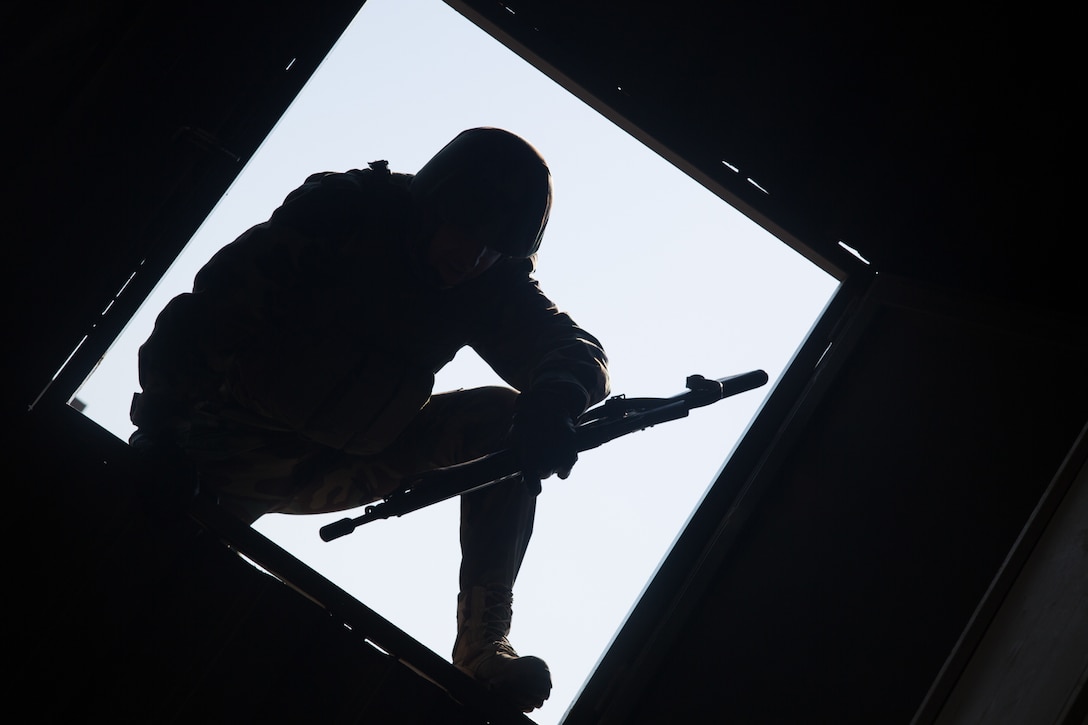 Peshmerga soldier climbs through window during building assault training at Bnaslawa, Iraq, on February 2, 2017, as part of critical training provided by Combined Joint Task Force–Operation Inherent Resolve (U.S. Army/Ian Ryan)