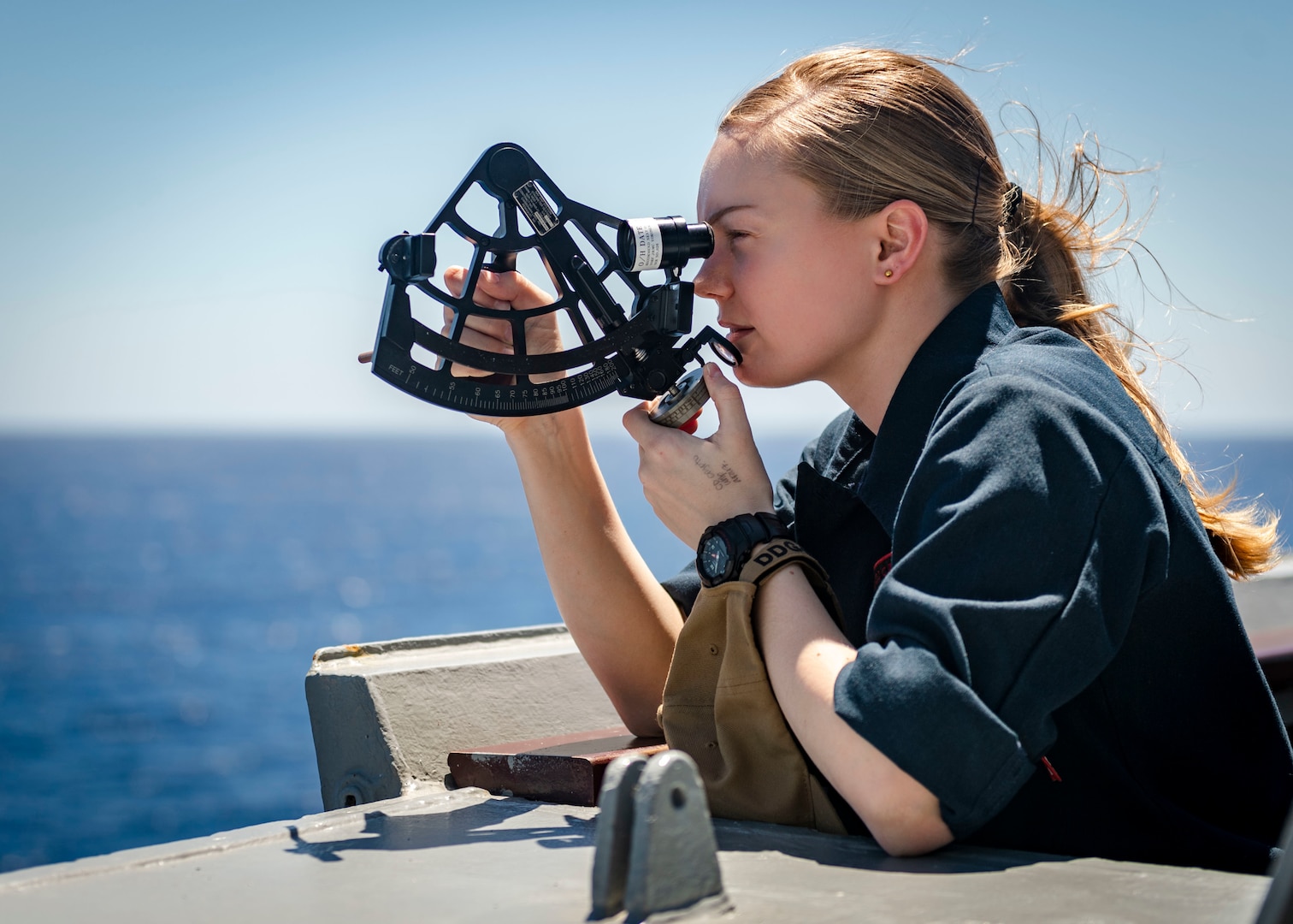 Sailor utilizes stadimeter on bridge wing aboard USS McCampbell prior to replenishment-at-sea with USNS Carl Brashear, South China Sea, March 12, 2020 (U.S. Navy/Markus Castaneda)