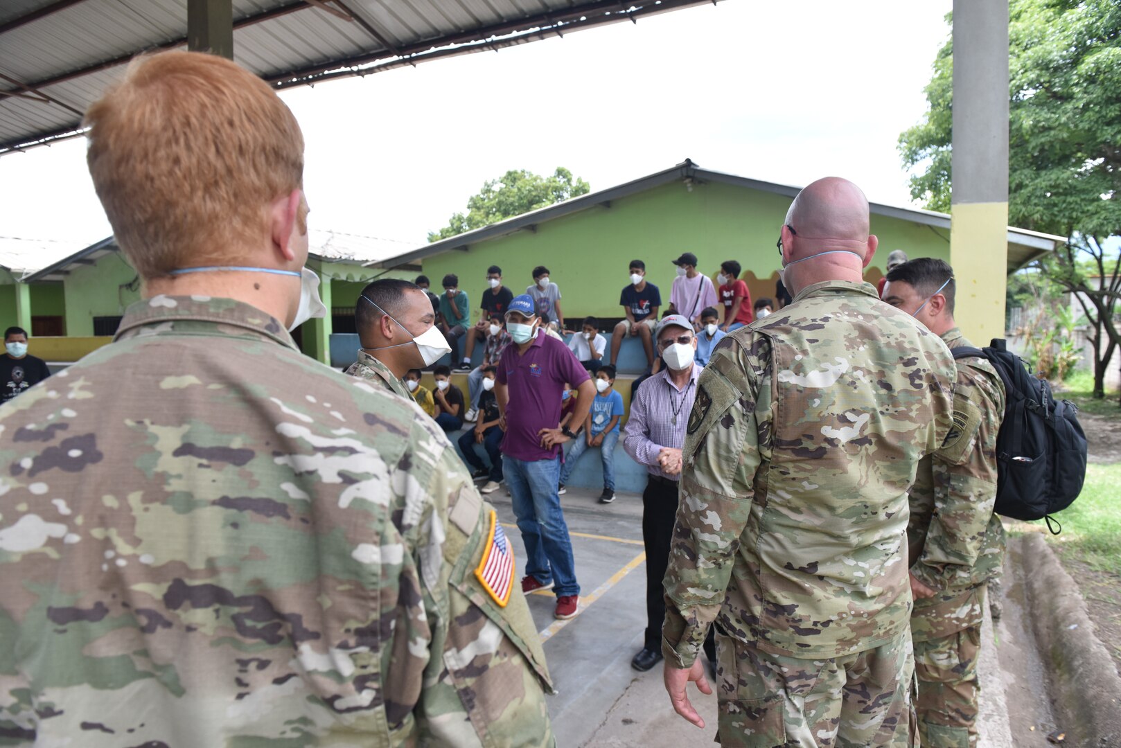 U.S. Army Capt. Joseph Sierra, Joint Task Force-Bravo Headquarters Support Company (HSC) commander, speaks to Father Gregorio about the needs of the Horizontes al Futuro Orphanage in Comayagua, Honduras, Sept. 5, 2020. The HSC sponsors the orphanage, periodically bringing in volunteers to spend recreational time with the children as well as contributing donations. The team took special care to observe strict COVID-19 protocols while conducting the visit for the safety of all involved.