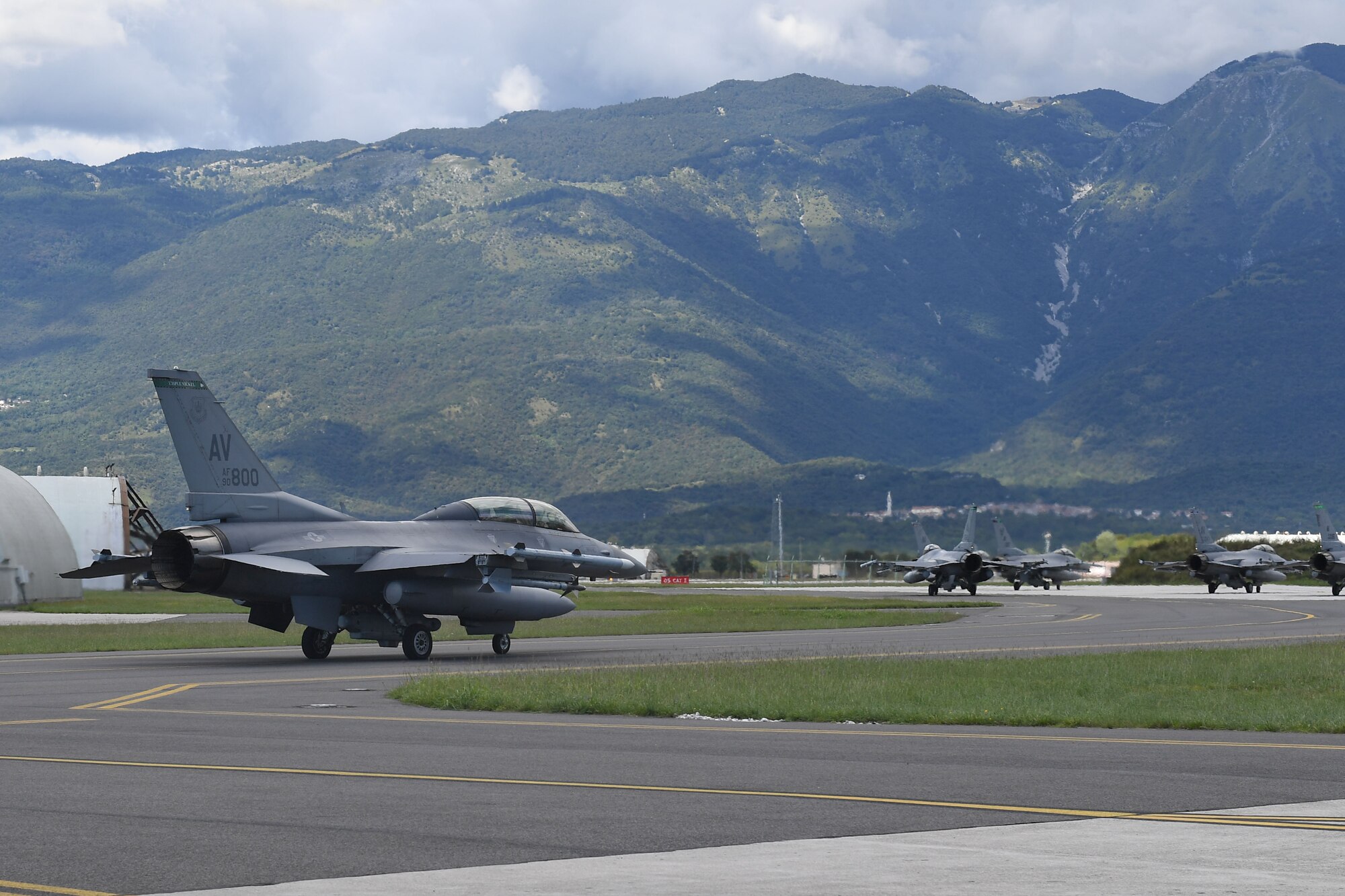 U.S. Air Force Staff Sgt. Devon Kercher, 31st Operations Support Squadron Radar Approach Control senior watch supervisor, and a U.S. Air Force F-16 Fighting Falcon pilot taxi on the flightline at Aviano Air Base, Italy, Sept. 3, 2020. Kercher was recently recognized as the 2019 U.S. Air Forces in Europe Air Traffic Controller of the Year and participated in a familiarization flight. (U.S. Air Force photo by Staff Sgt. Valerie Halbert)