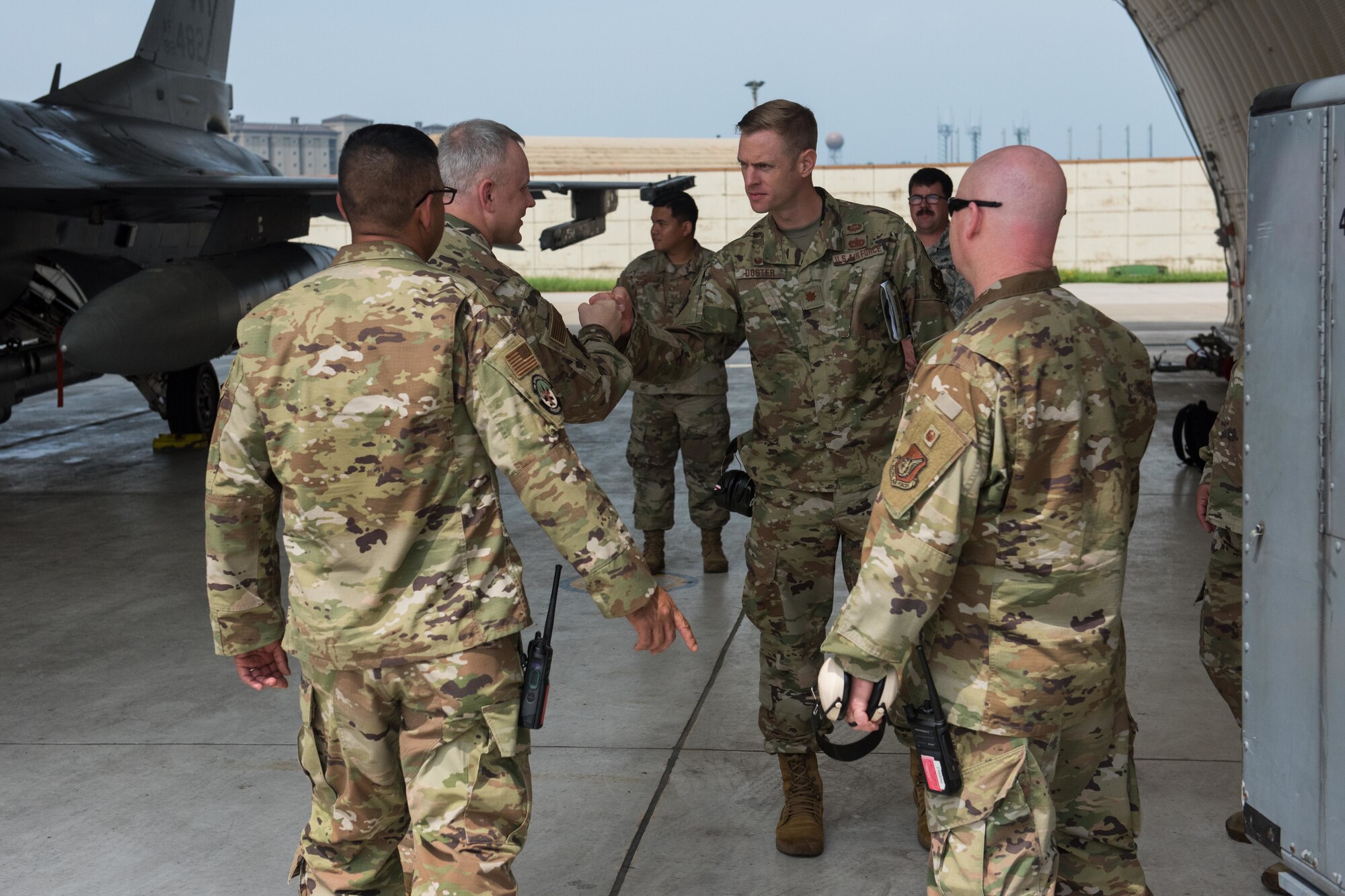 A photo of a commander greeting another commander.