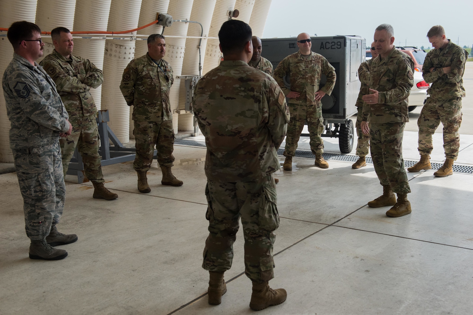 A photo of a command chief speaking to Airmen.