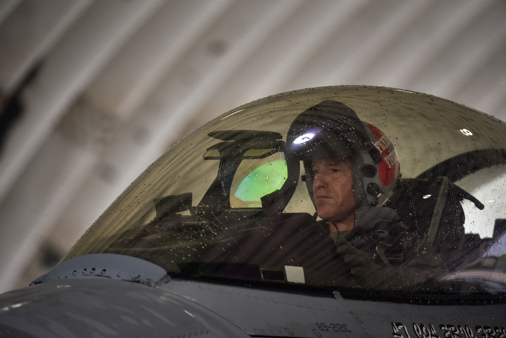 A photo of a pilot inside an aircraft.