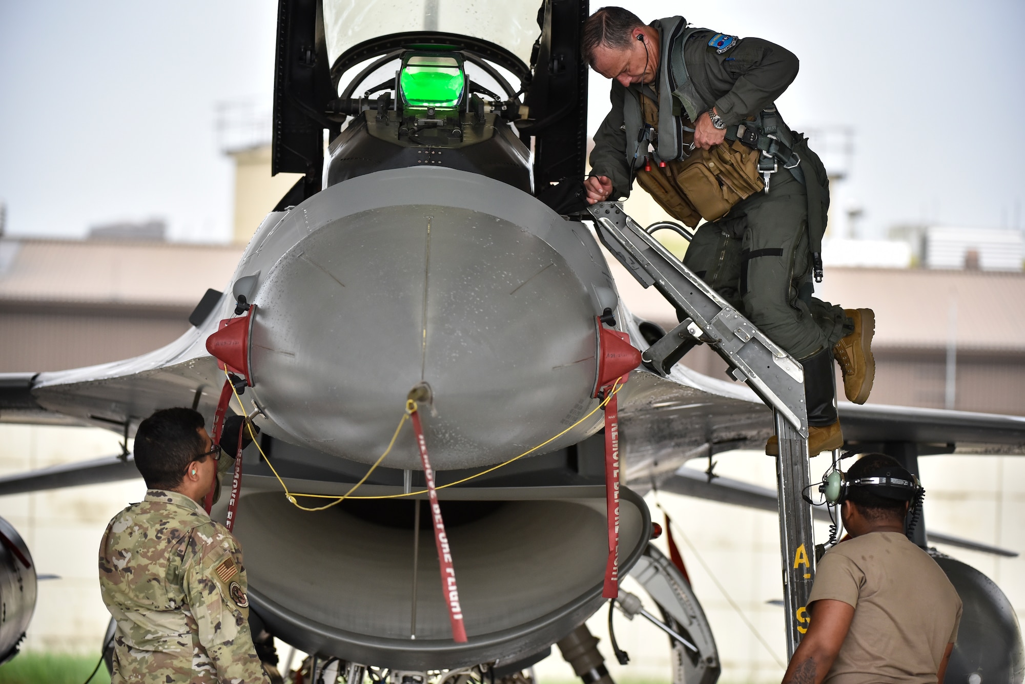 A photo of an Airman exiting an aircraft.