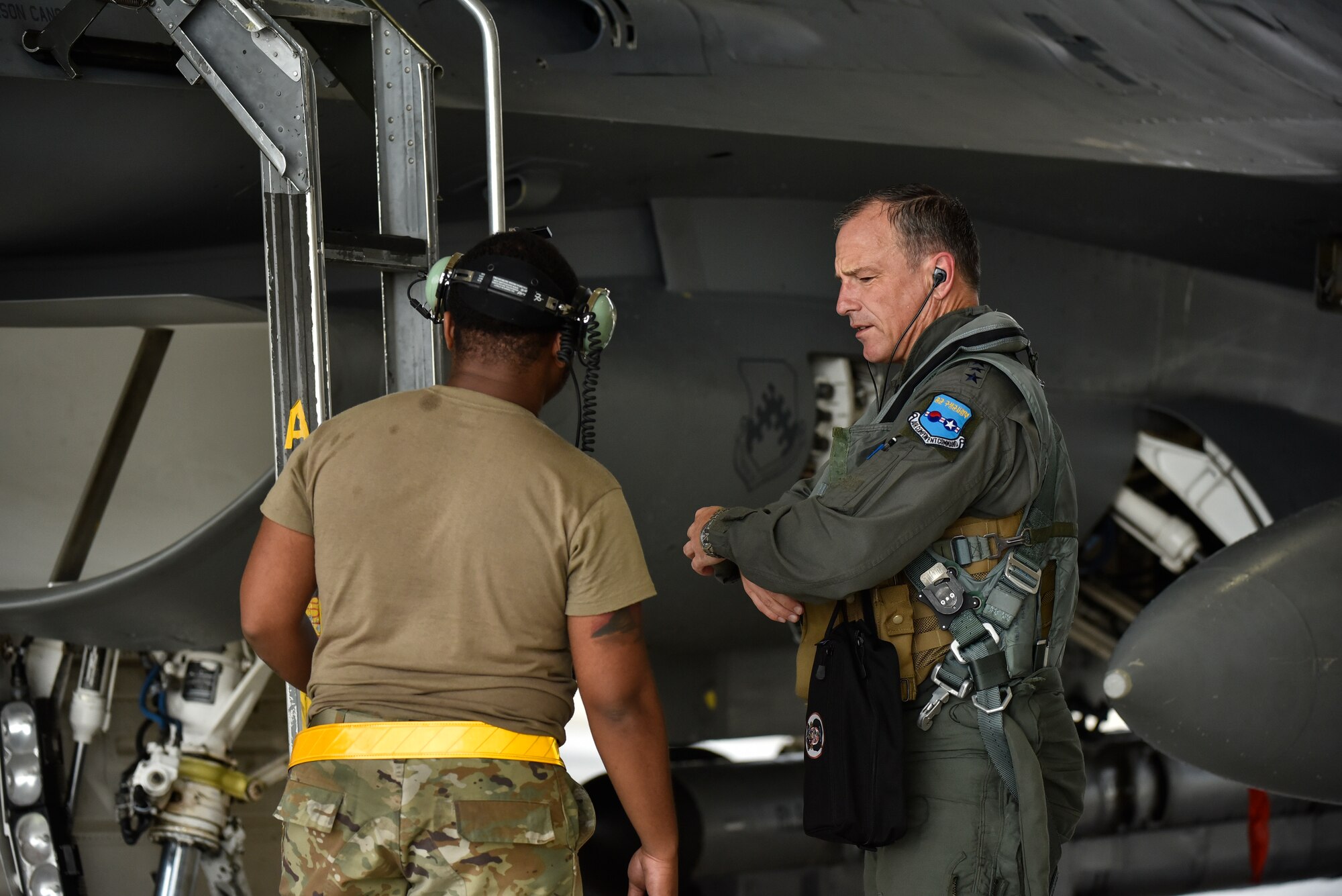 A photo of Airmen talking.