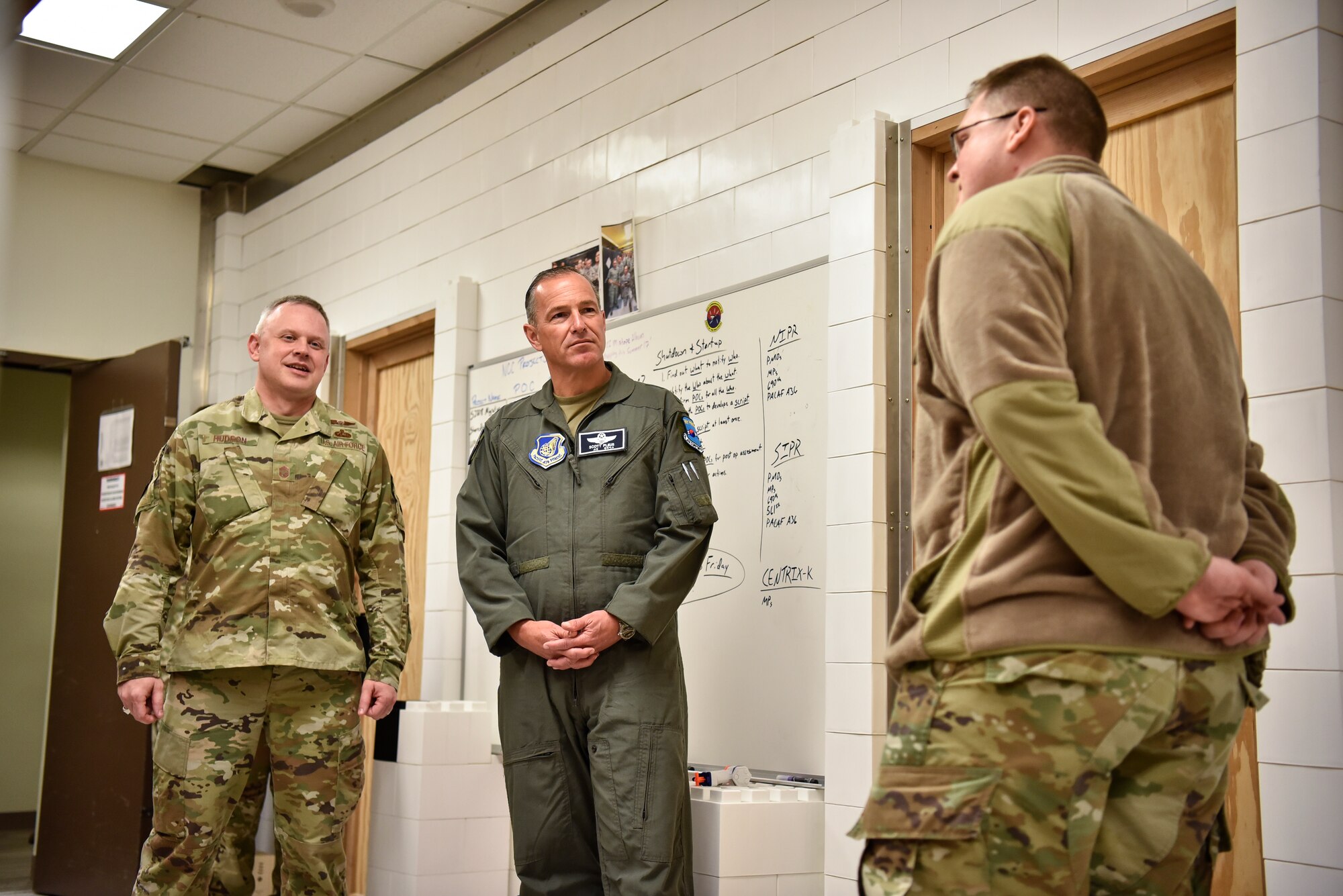 A photo of Airmen talking.