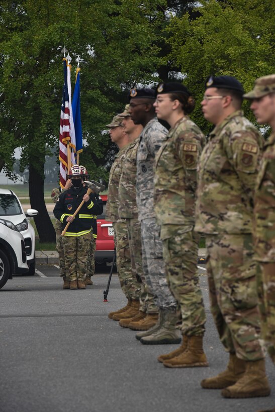 First responder Honor Guard members prepare to post colors during a 9/11 memorial service on Kunsan Air Base, Republic of Korea.