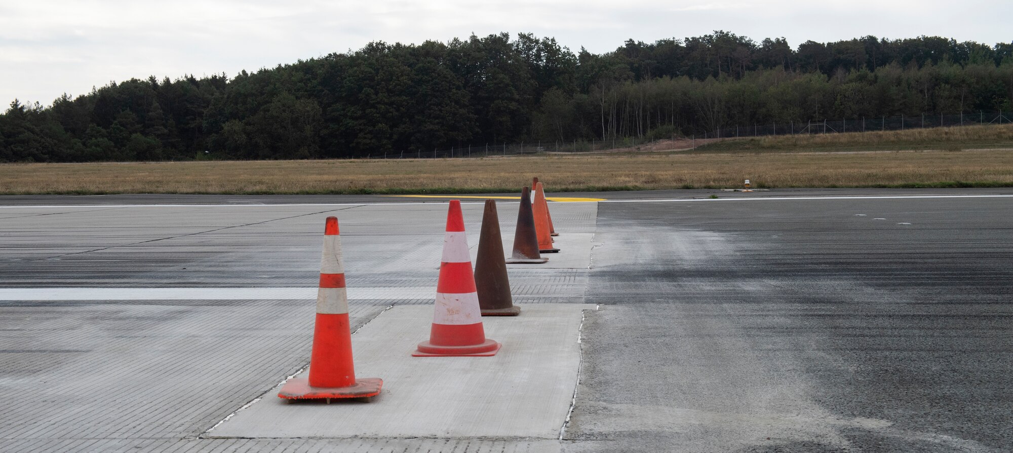 Traffic cones sit on the site where pavement was replaced on the flightline at Spangdahlem Air Base, Germany, Sept. 10, 2020. The Dirt Boyz completed this repair over the long holiday weekend and allowed this section of the runway to be operational by the intended date. (U.S. Air Force photo by Airman 1st Class Alison Stewart)