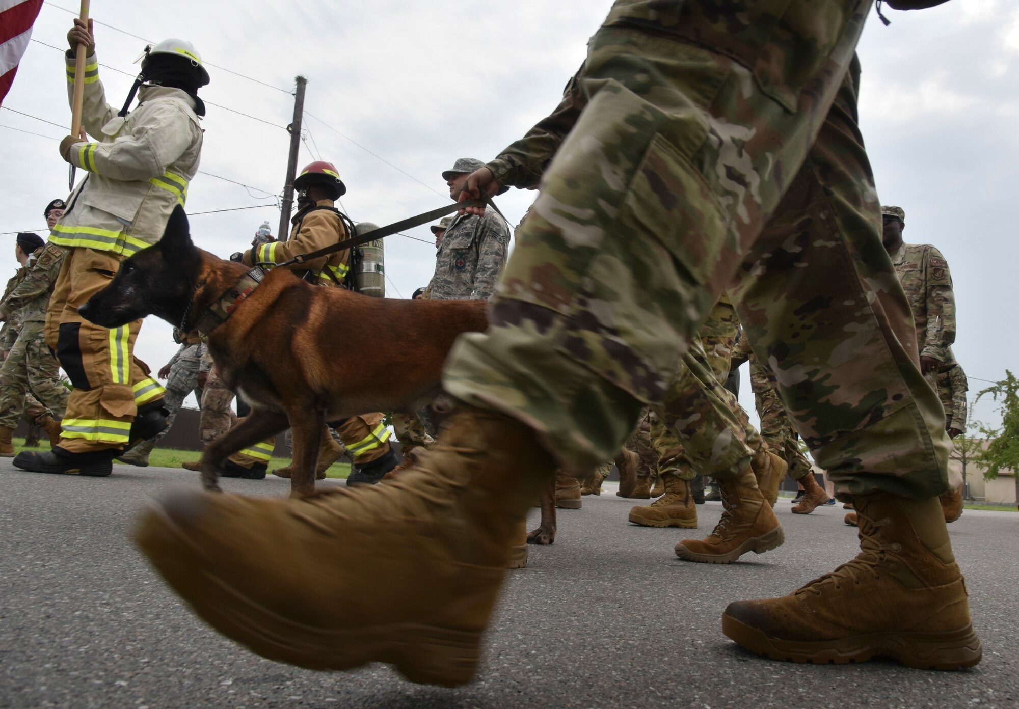 First responders march together after a 9/11 ceremony on Kunsan