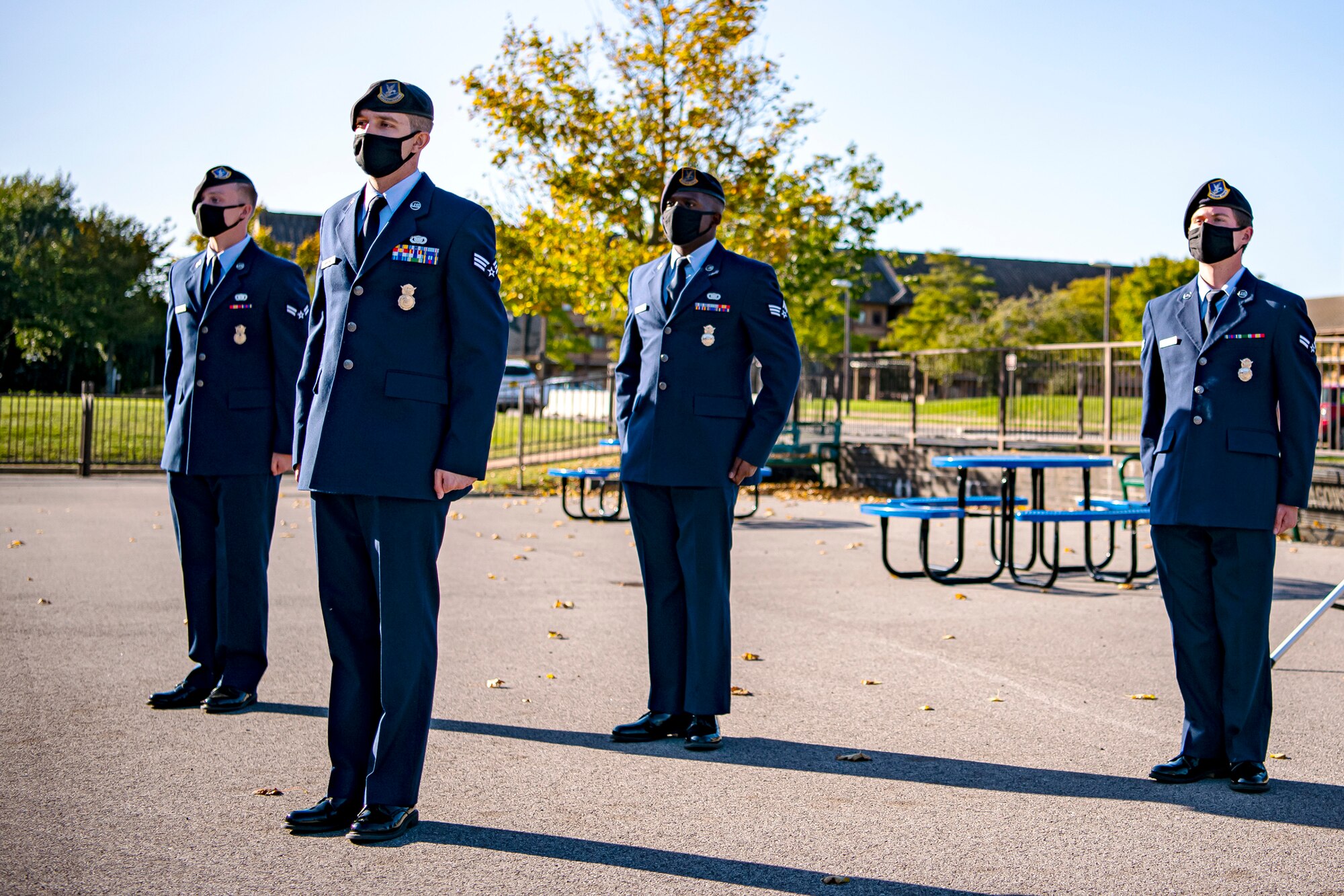 Airmen from the 423rd Security Forces Squadron stand at attention during a 9/11 remembrance ceremony at RAF Alconbury, England, Sep. 9, 2020. Airmen from the 501st Combat Support Wing along with cadets from the Alconbury High School JROTC participated in the ceremony to honor those who lost their lives during the September 11th terrorist attacks. (U.S. Air Force photo by Senior Airman Eugene Oliver)
