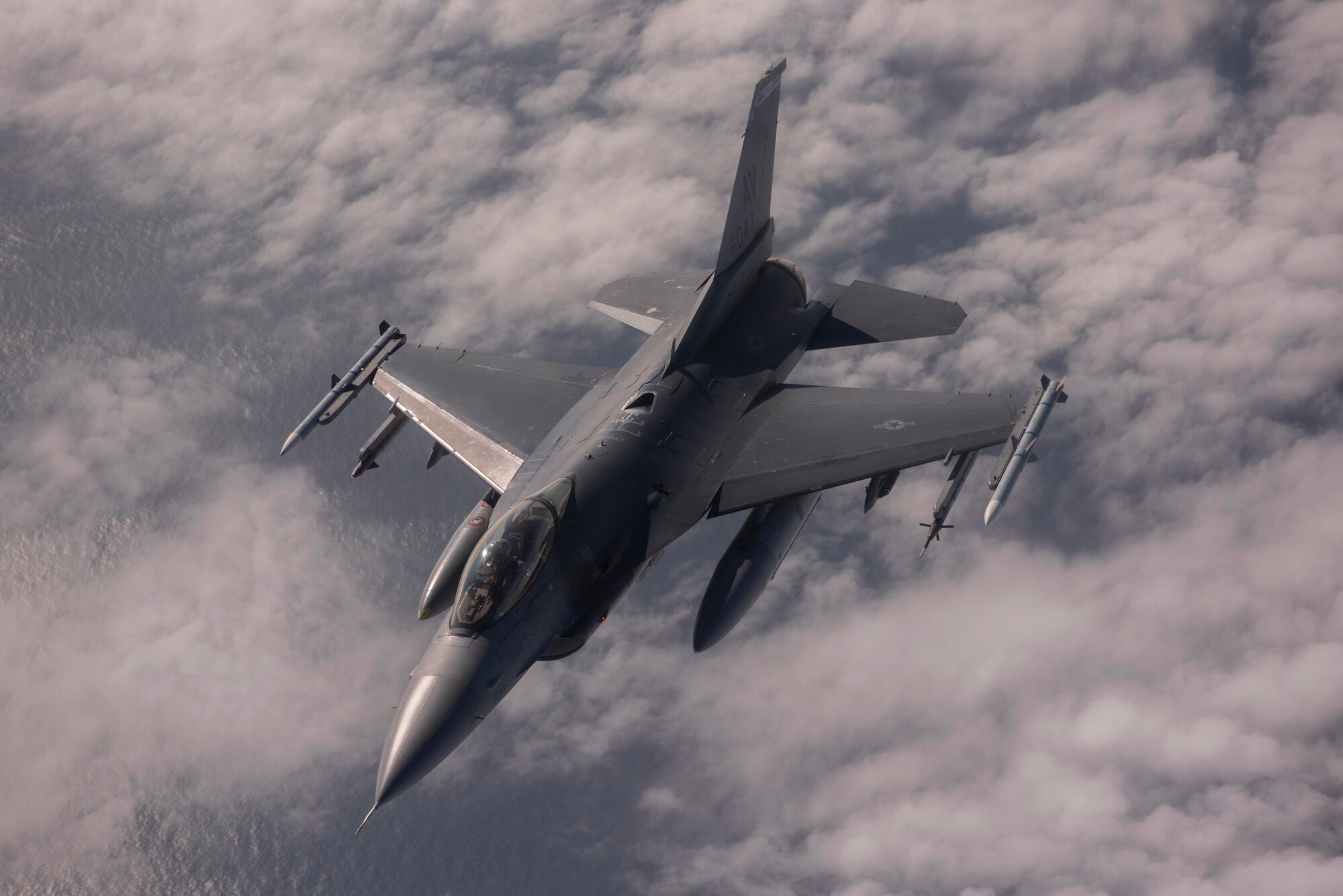 An F-16 Fighting Falcon aircraft assigned to the 31st Fighter Wing, Aviano Air Base, Italy, departs from a KC-135 Stratotanker aircraft assigned to the 100th Air Refueling Wing, Royal Air Force Mildenhall, England, after receiving fuel during exercise Point Blank over the North Sea, Sept 10, 2020. The KC-135 aircraft supported allied and partner-nation aircraft in sharpening combat readiness, increasing tactical proficiency, and demonstrating a collective commitment to regional security during the exercise. (U.S. Air Force photo by Airman 1st Class Joseph Barron)
