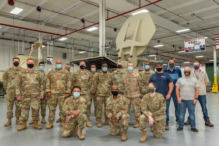 Tobyhanna Army Depot team members pose with Soldiers from the 392nd Expeditionary Signal Battalion, 359th Theater Tactical Signal Brigade after the conclusion of their "side-by-side" training in August 2020.