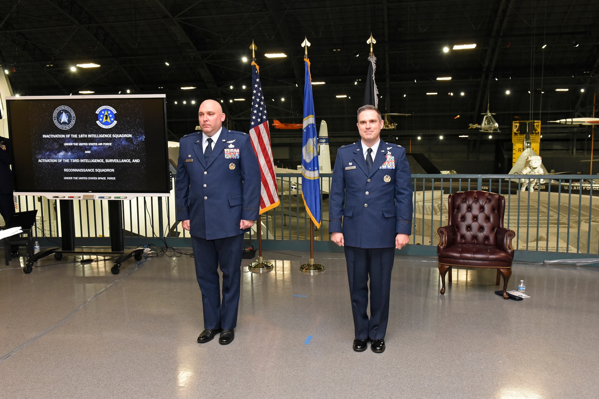 Col. Chandler P. Atwood (left), commander, Space Delta 7, U.S. Space Force, inactivates the 18th Intelligence Squadron and activates the 73rd Intelligence, Surveillance and Reconnaissance Squadron under the command of Lt. Col. Nathaniel A. Peace (right), U.S. Space Force, during a ceremony at the National Museum of the U.S. Air Force at Wright-Patterson Air Force Base, Sept. 3. (U.S. Air Force photo/Ty Greenlees)