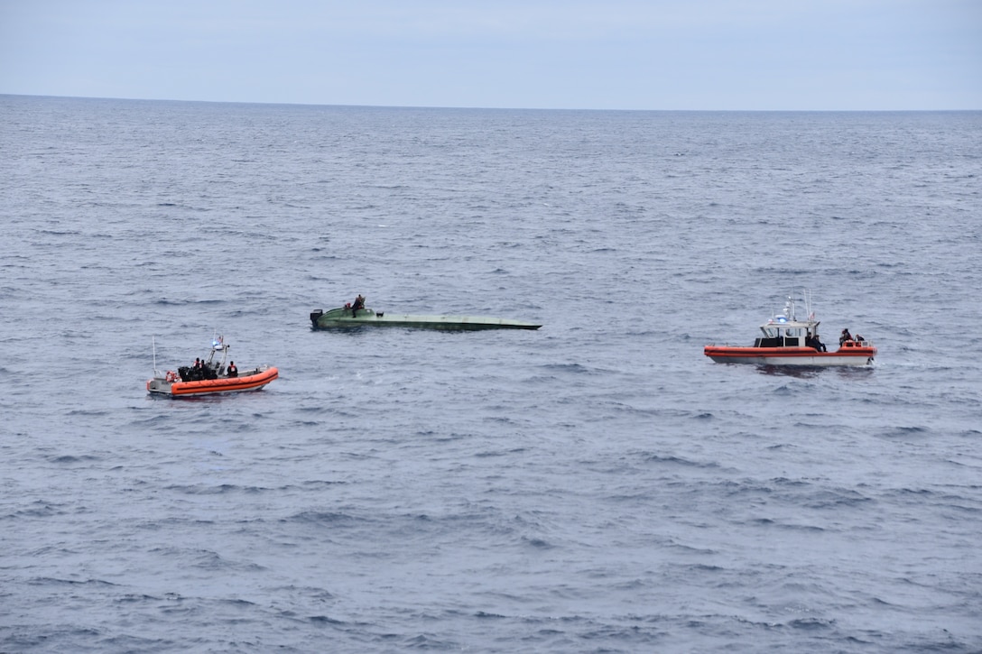 Coast Guard Cutter Bertholf (WMSL-750) crewmembers inspect a low-profile semi-submersible in international waters of the Eastern Pacific Ocean Aug. 14, 2020.