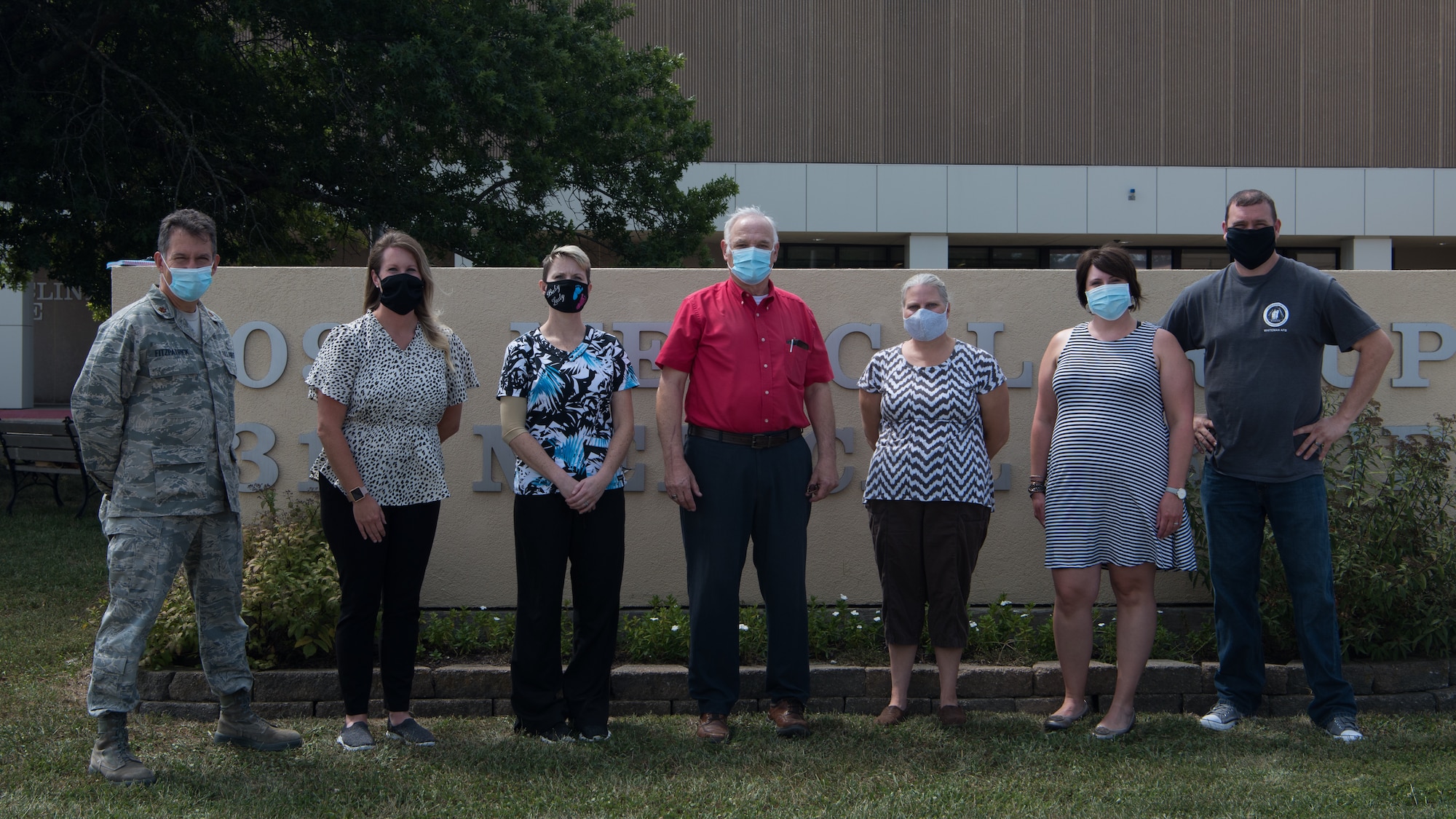 Members of the 509th Medical Group Family Advocacy Program stand for a photo on August 28, 2020 in front of the 509th MDG Clinic at Whiteman Air Force Base, Missouri. The Family Advocacy Program provides support for families through education along with prevention and response to domestic violence. (U.S. Air Force photo by Airman 1st Class Parker J. McCauley)