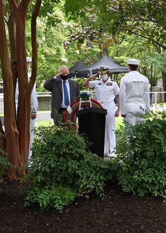 Each year ONI remembers eight ONI shipmates who lost their lives during the terrorist attack at the Pentagon on September 11, 2001. A commemoration ceremony is held in the Remembrance Garden of the National Maritime Intelligence Center. Capt. Tom Bortmes was ONI’s commanding officer when the attacks occurred and he has attended each remembrance ceremony since the first one was held in October 2001. Pictured here, Bortmes and ONI Commander Rear Adm. Kelly Aeschbach place a wreath in the garden where a marker bears the names and pictures of the Naval Intelligence professionals who passed that day: Cmdr. Dan Shanower, Lt. Cmdr. Vince Tolbert, Lt. Jonas Panik, Lt. Darin Pontell, Petty Officer 1st Class Julian Cooper, Angela Houtz, Brady Howell, and Gerry Moran. A bell tolled as each name was read.