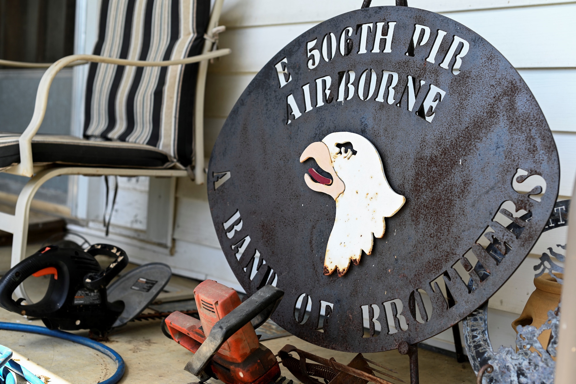 Bradford Freeman, assigned to ‘Easy’ Company, 2nd Battalion of the 506th Parachute Infantry Regiment of the 101st Airborne Division, has memorabilia on his porch. The popular television show ‘Band of Brothers’ depicted Freeman and his achievements with the help of many Easy Company team members. (U.S. Air Force photo by Senior Airman Keith Holcomb)