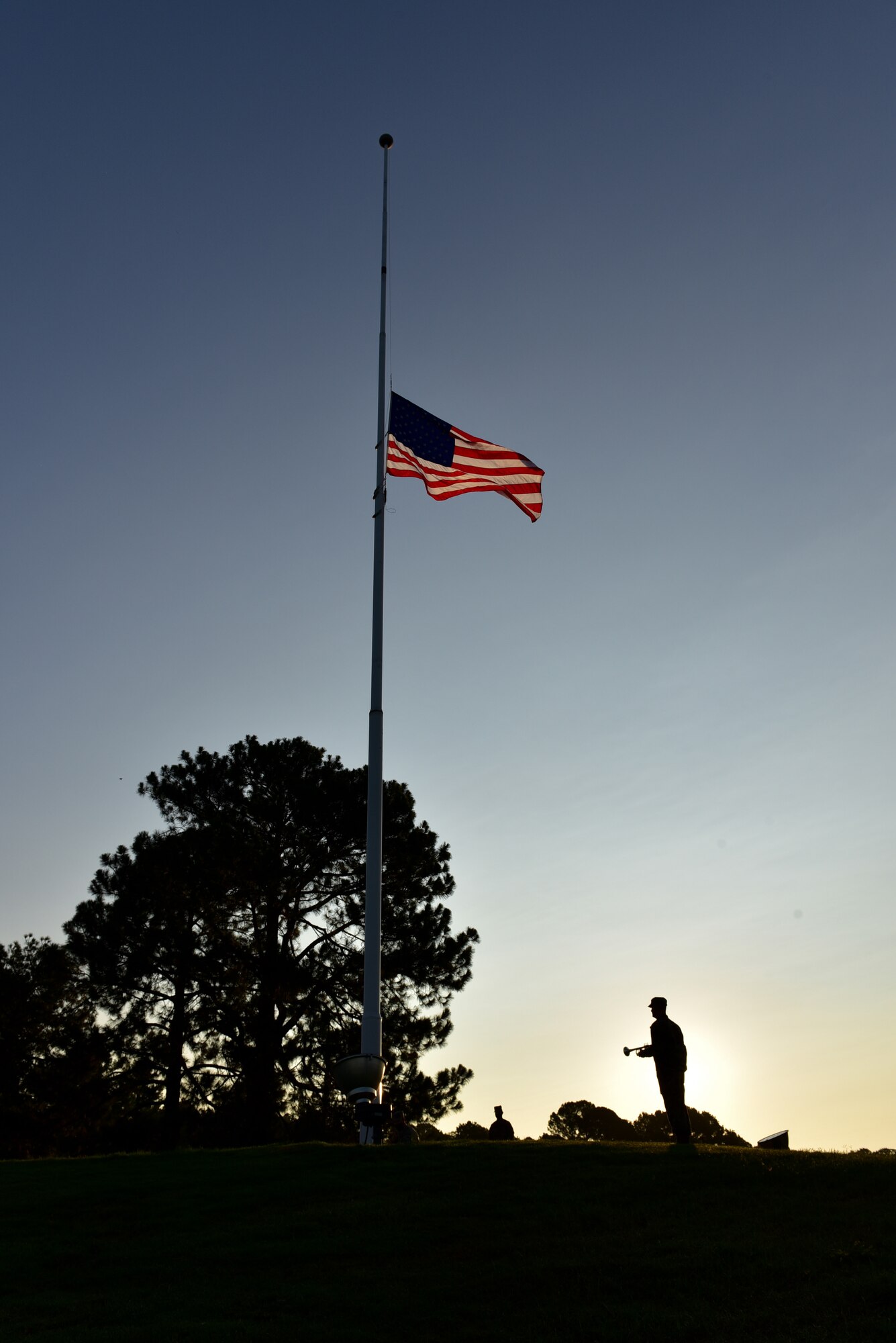 An Airman salutes the American flag