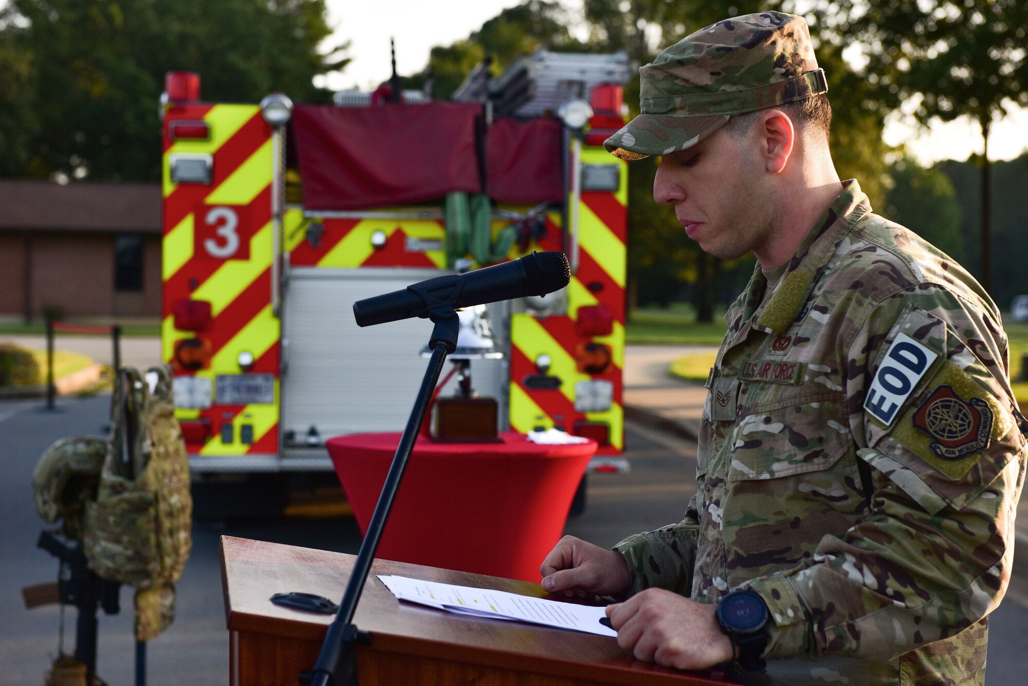 An Airman speaks at a 9/11 ceremony