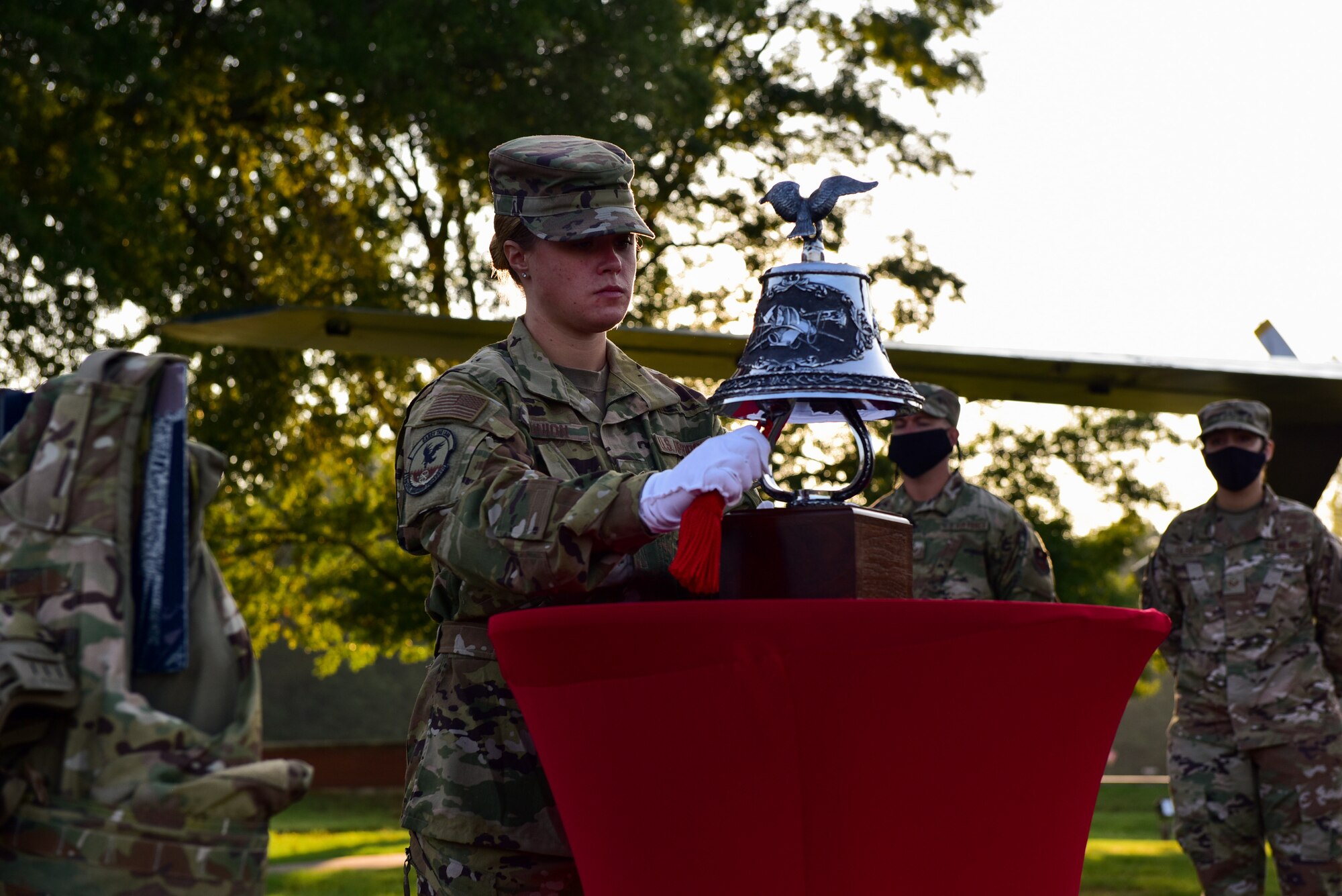 An Airman rings a bell