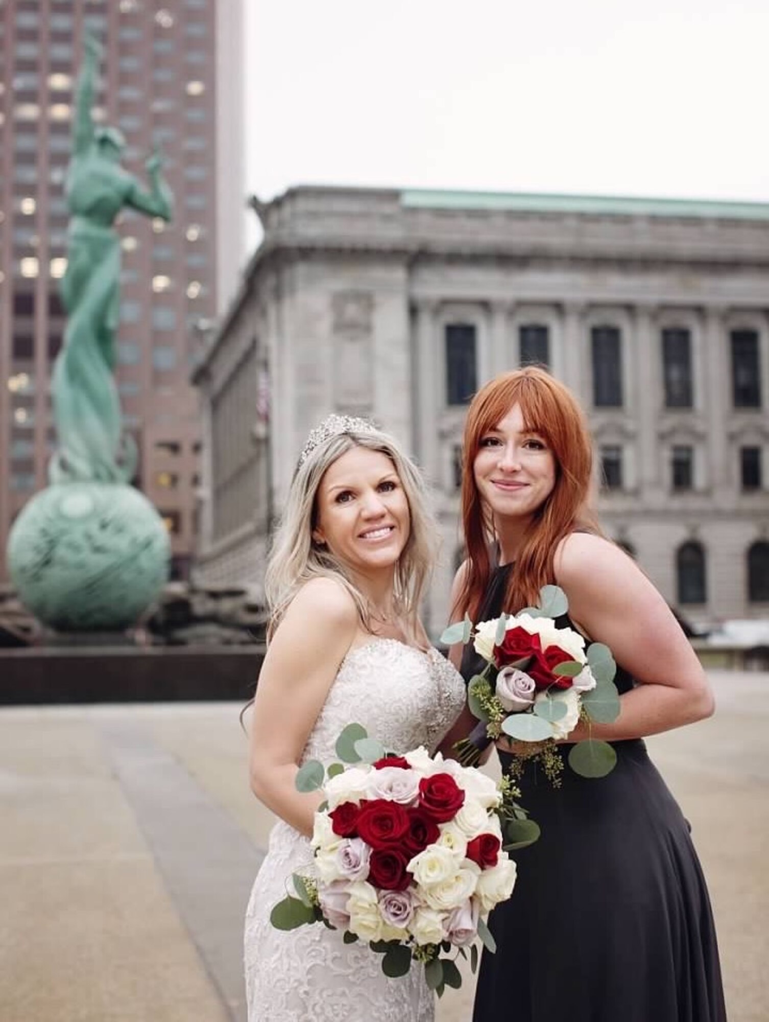 Staff Sgt. Juliet Louden, the NOIC of community engagement, and Staff Sgt. Sarah Gruber, a broadcast journalist, both assigned to the 910th Airlift Wing public affairs office, pose for a photo in front of Marshall Frederick’s Cleveland War Memorial Fountain in Cleveland, Ohio, Nov 15, 2019.