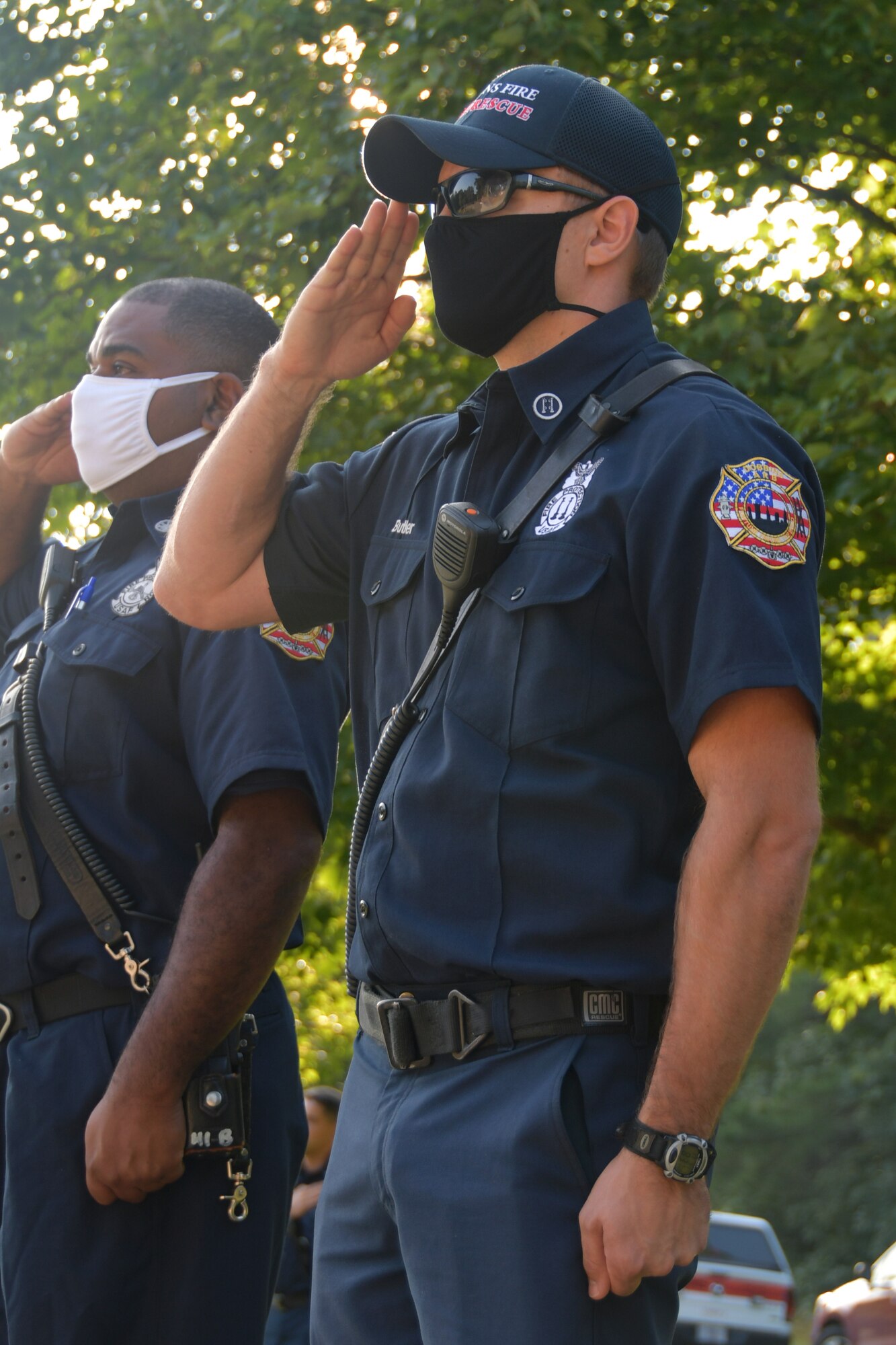 Capt. Jones Butler, lead firefighter at Dobbins Fire Emergency Services, salutes at a 9/11 Remembrance Ceremony at the POW/MIA Memorial at Dobbins Air Reserve Base, Ga. The ceremony included a moment of silence, command commentaries and an honor guard presentation. (U.S. Air Force photo by Senior Airman Shelby Thurman)
